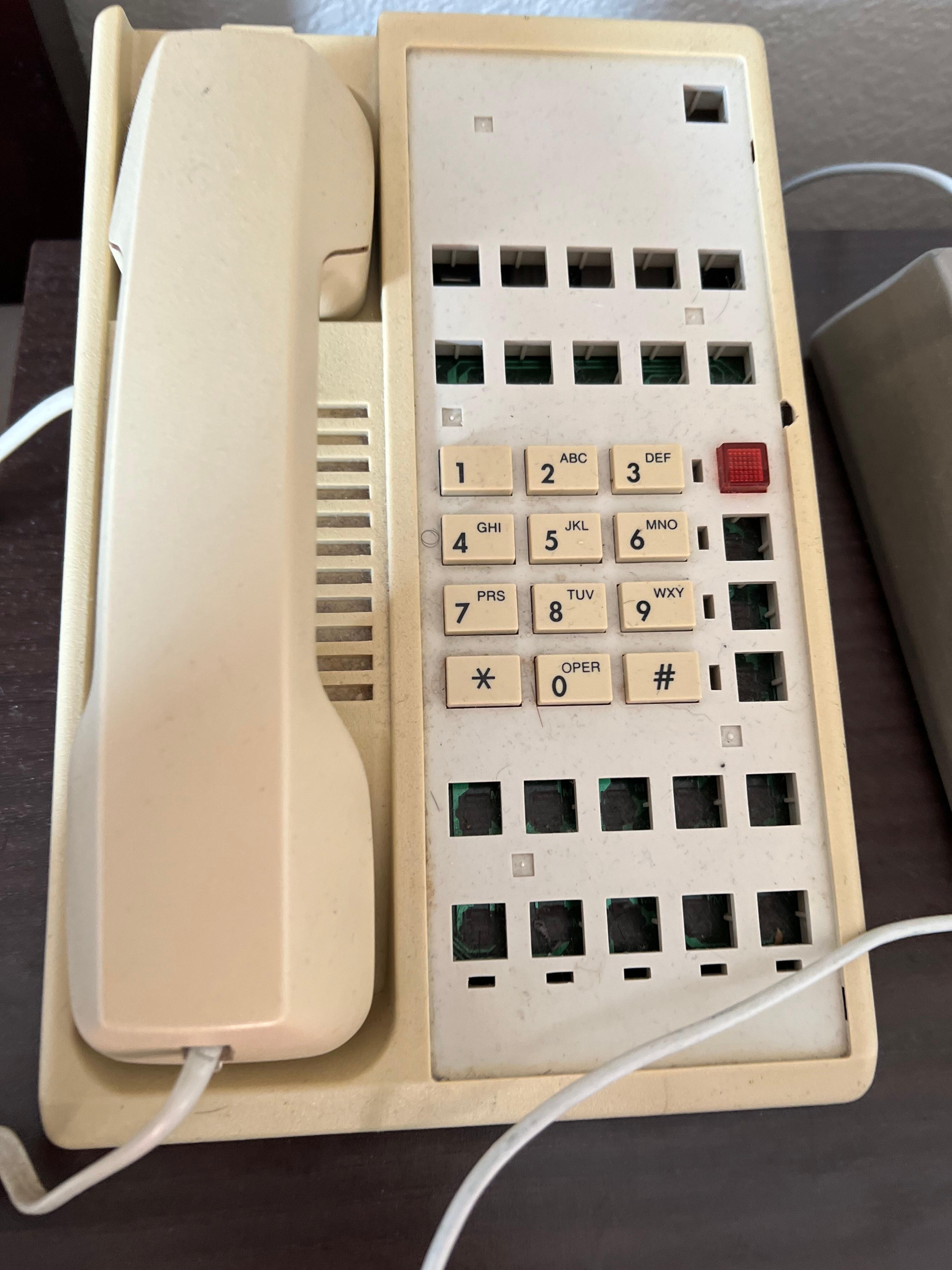 Cord was ripped out and broken. The phone was a shell. No inner workings 