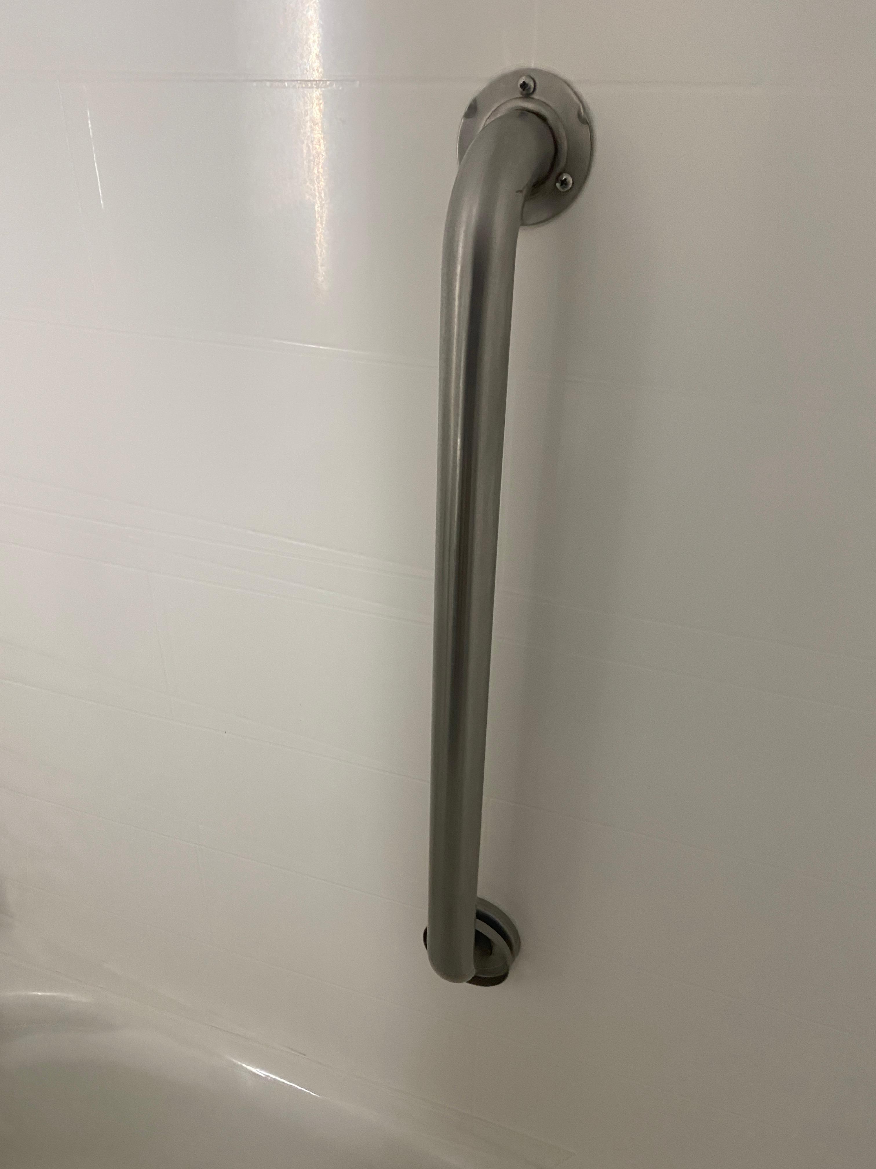 Shower grab bar flange is not mounted. 