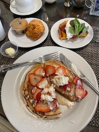Ricotta strawberry pancakes and eggs Benedict