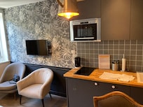 Kitchen with induction stove top and microwave