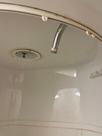 No shower head or shower curtain