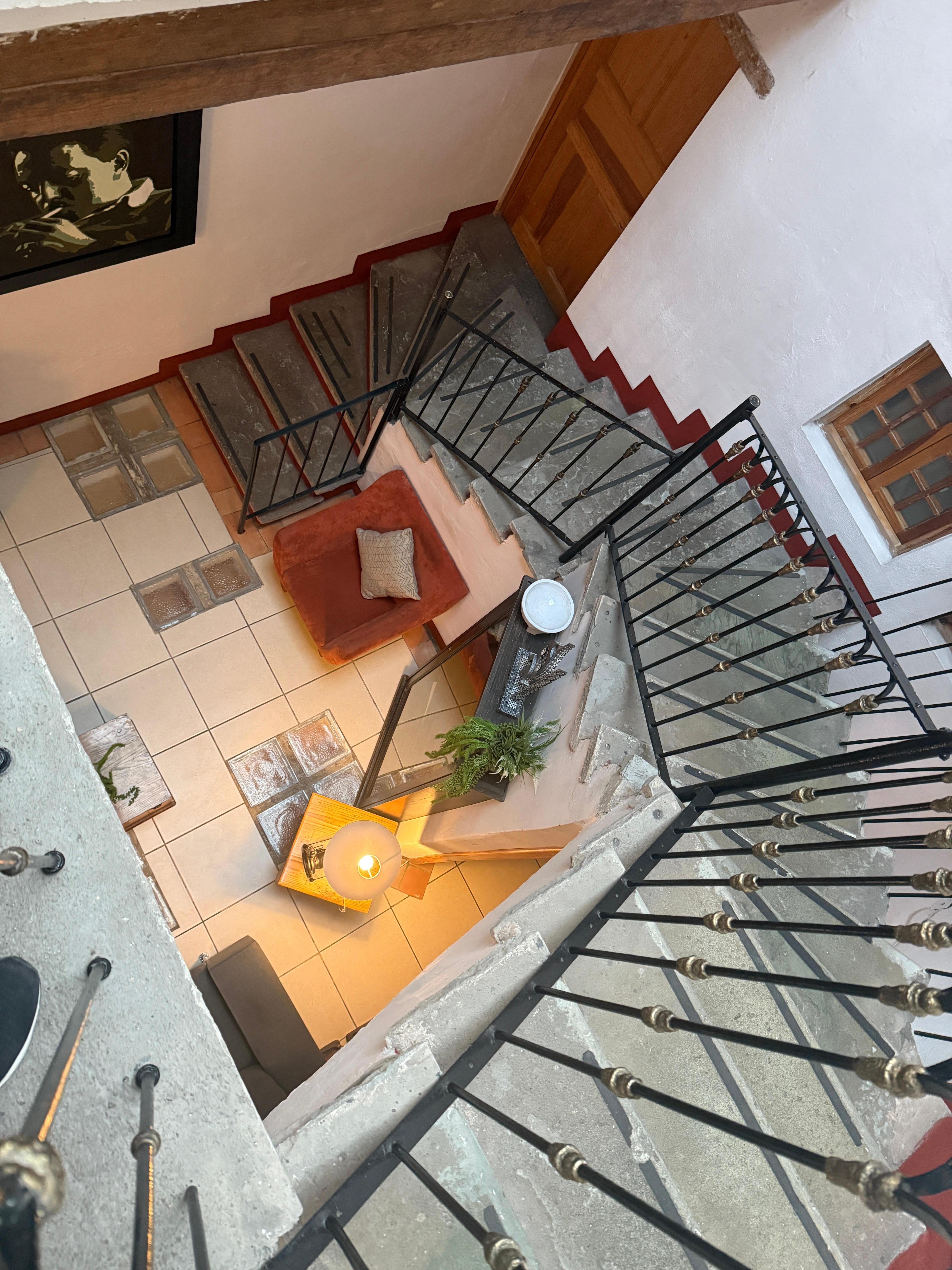 Narrow small staircase leading to closet of a lobby