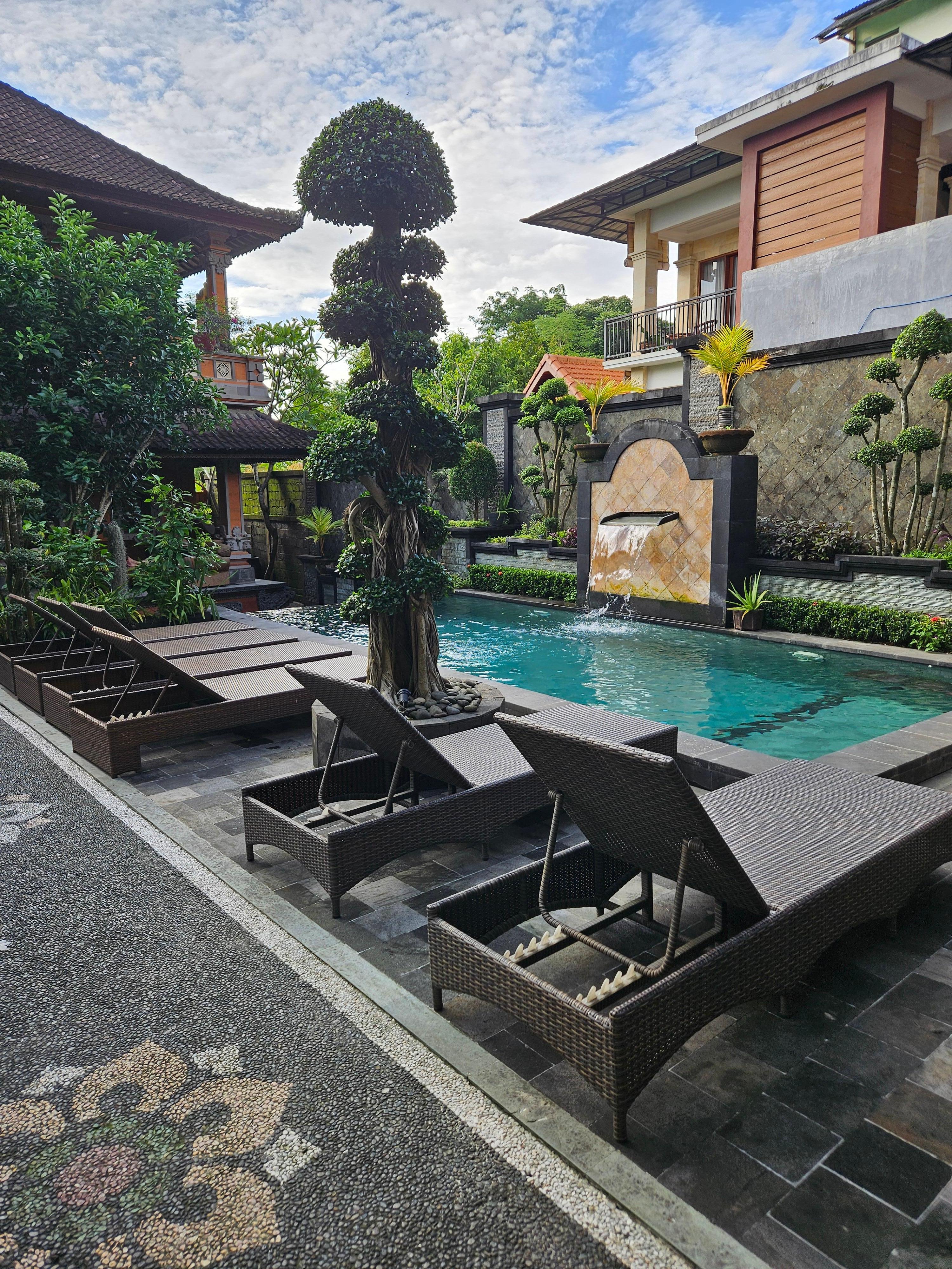 Small, tranquil pool with lounges