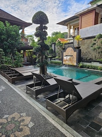Small, tranquil pool with lounges
