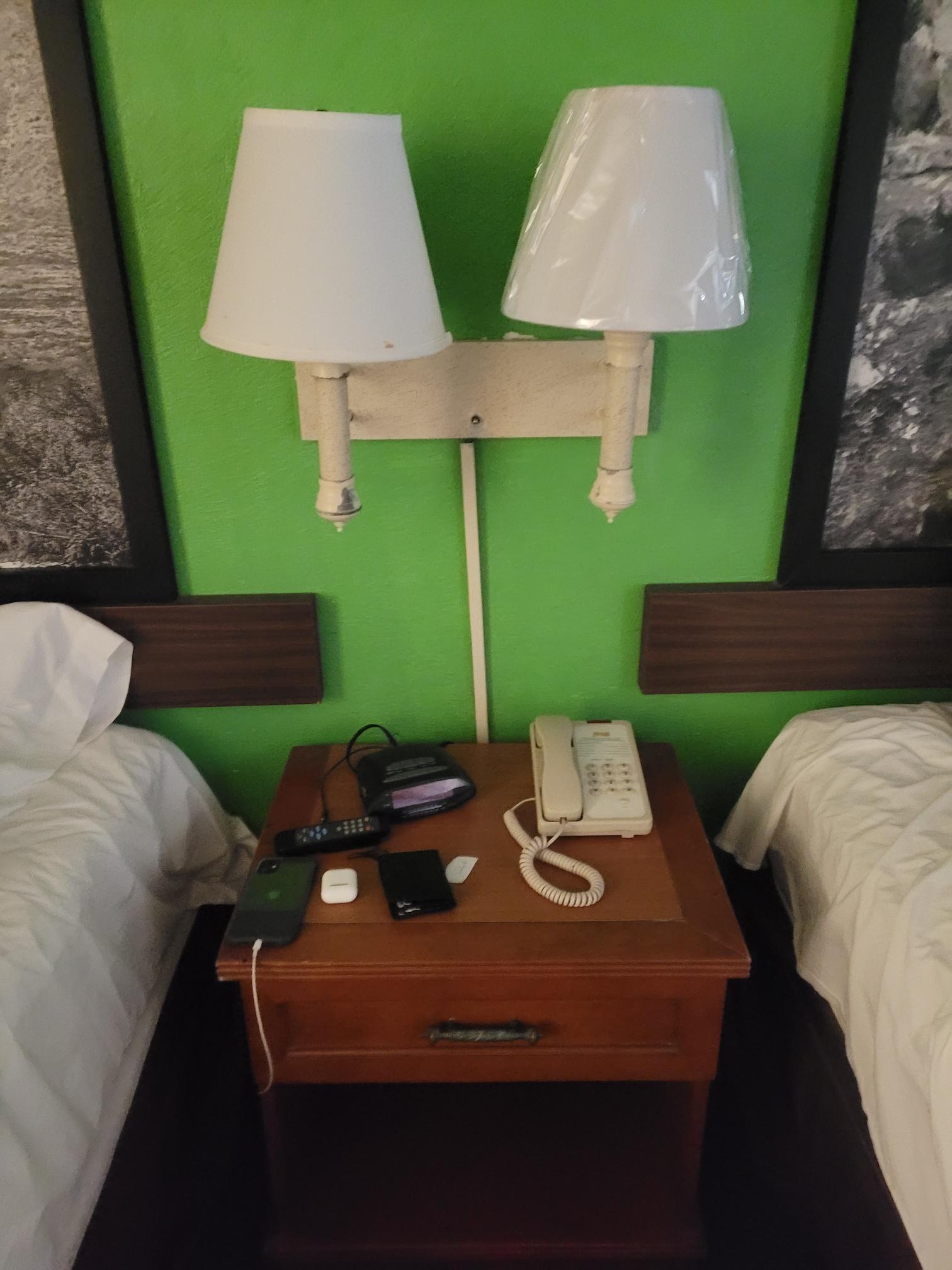 No functional bedside lamps or phone; TV remote worked 50%