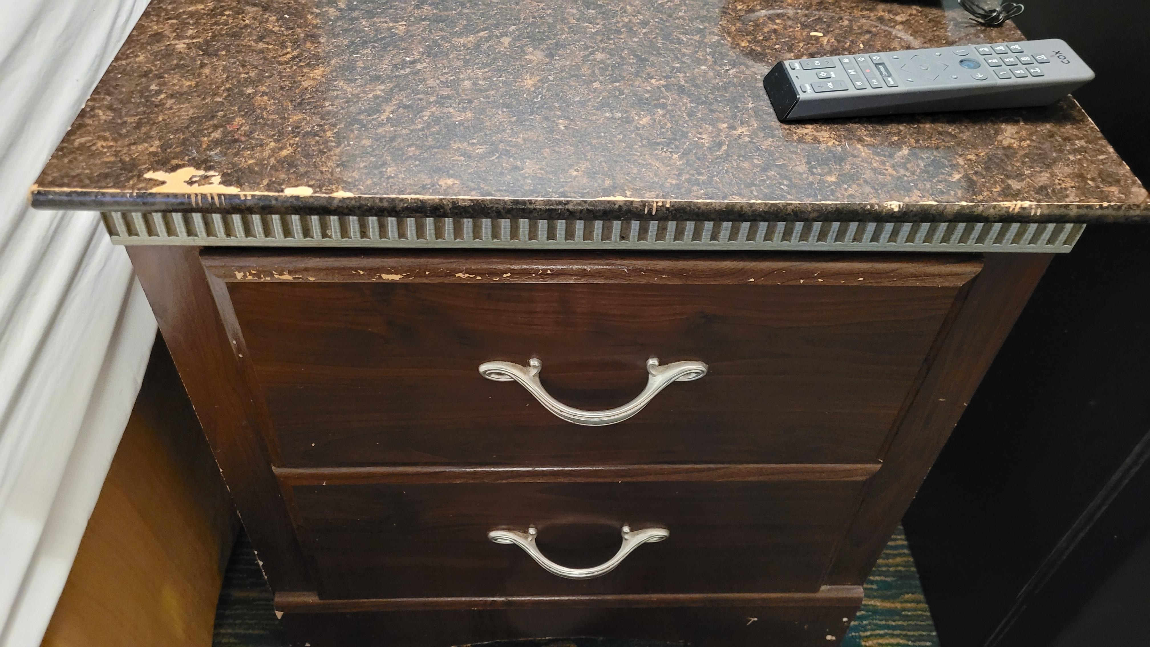 Chipped old bedside furniture