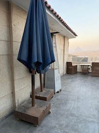 Old dusty and worn out parasols.