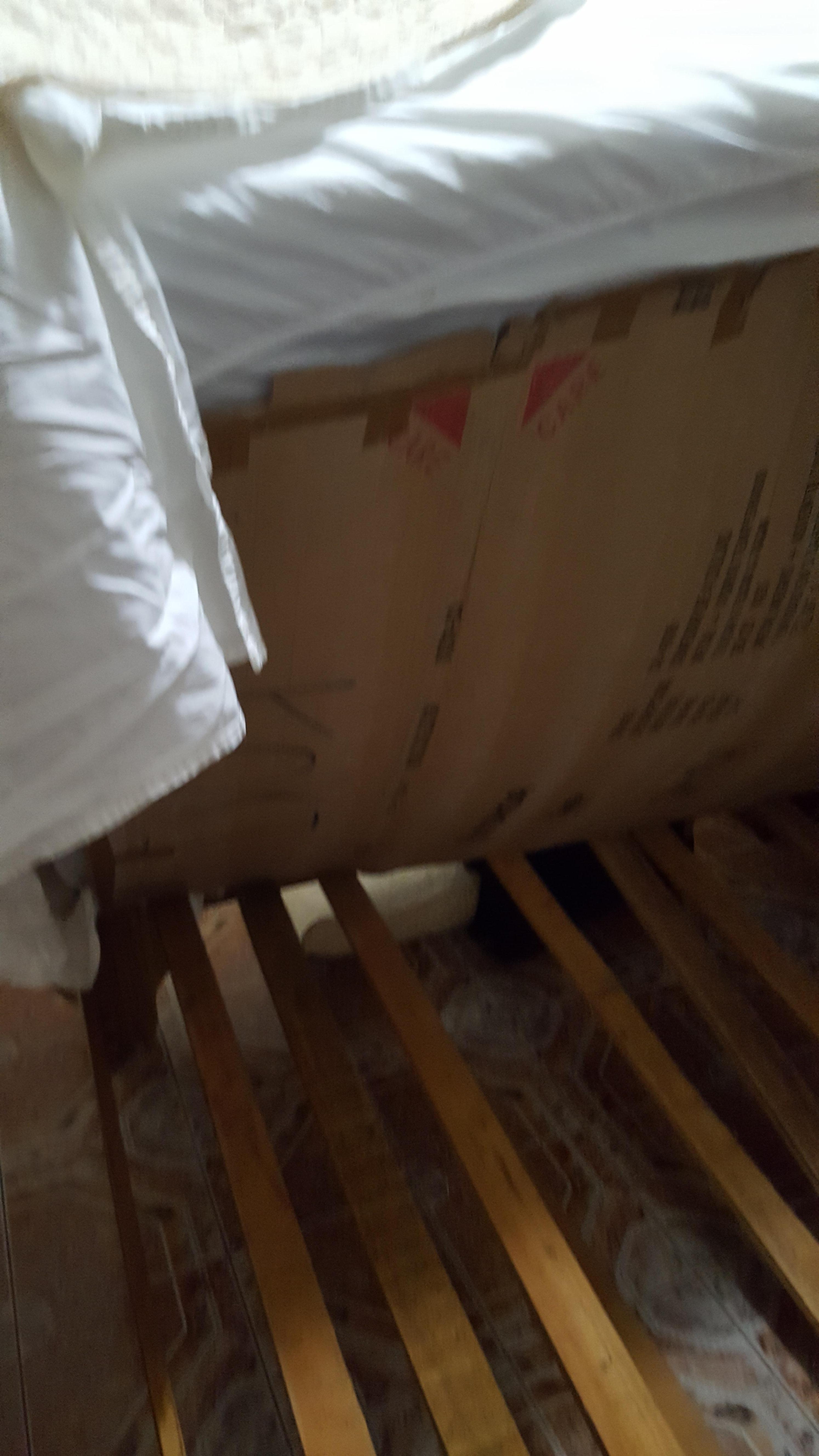 Broken bed - when we looked underneath there was a layer of cardboard and previous repair? 