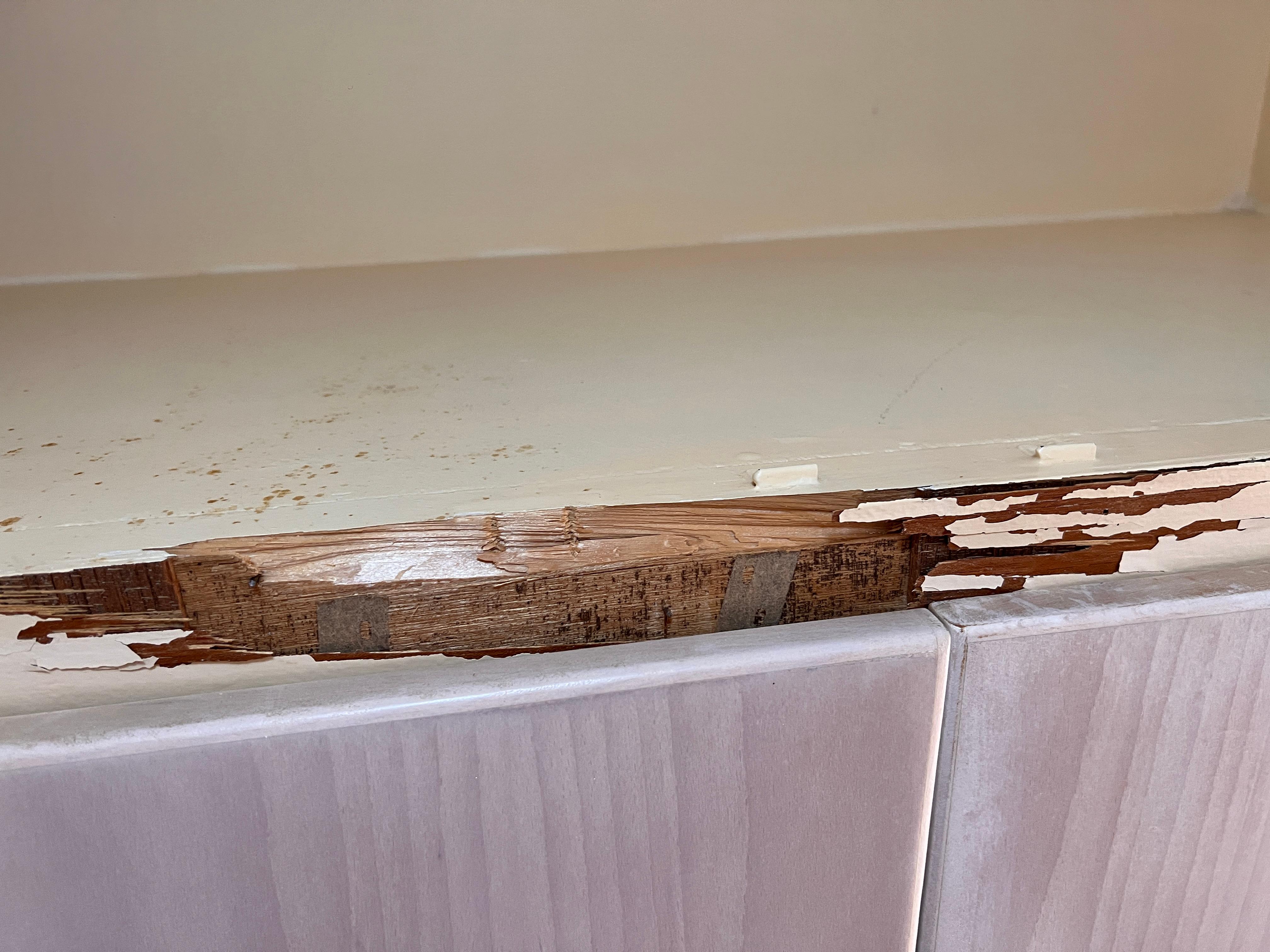 Rotting wood on cupboard 