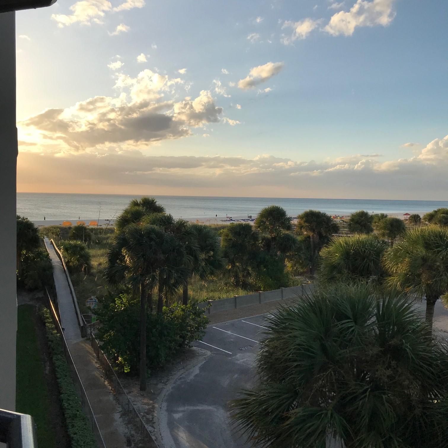 View from condo unit balcony.  Beach and public parking.