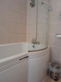 Damaged bath side panel.