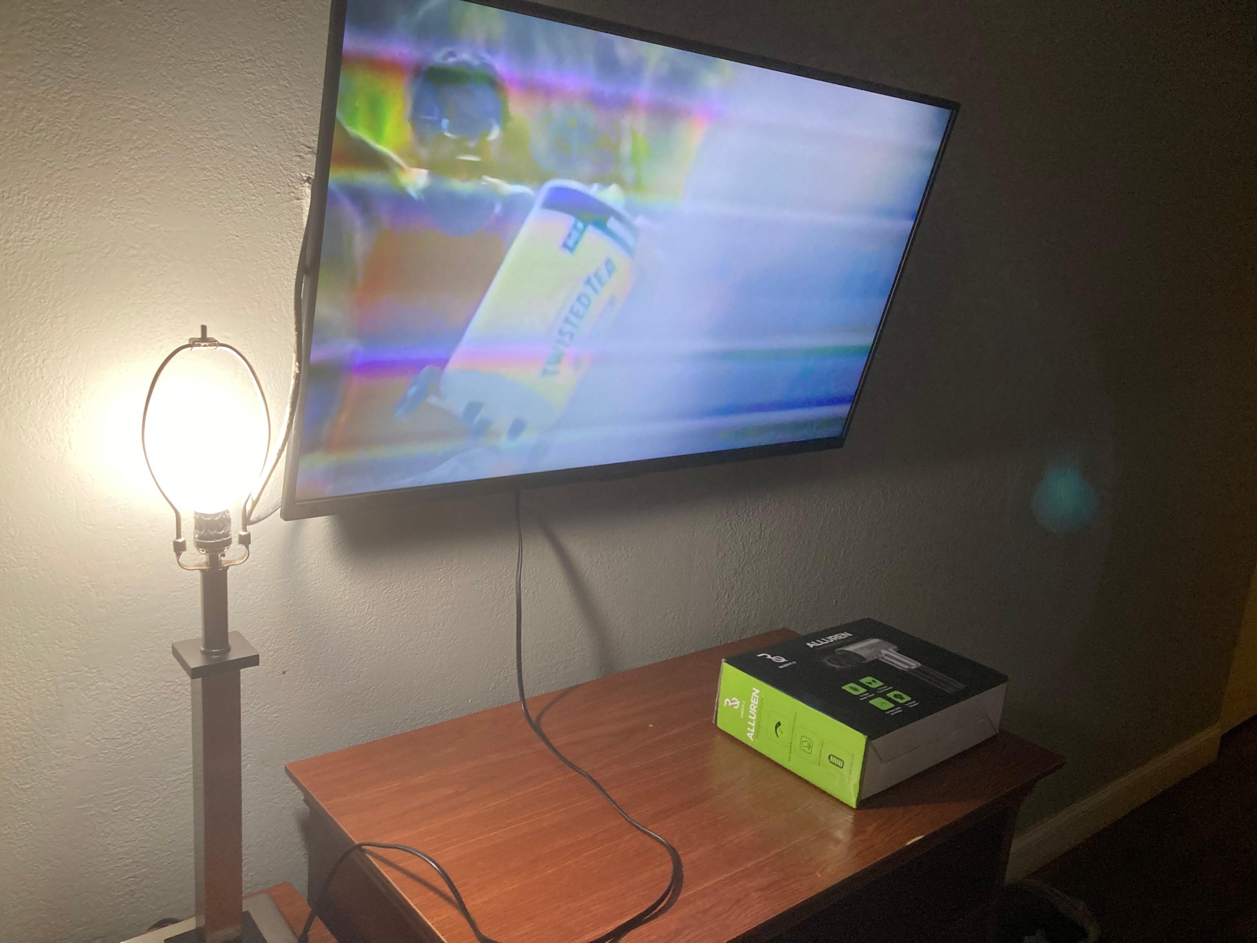 TV with lines and only lamp w/no shade