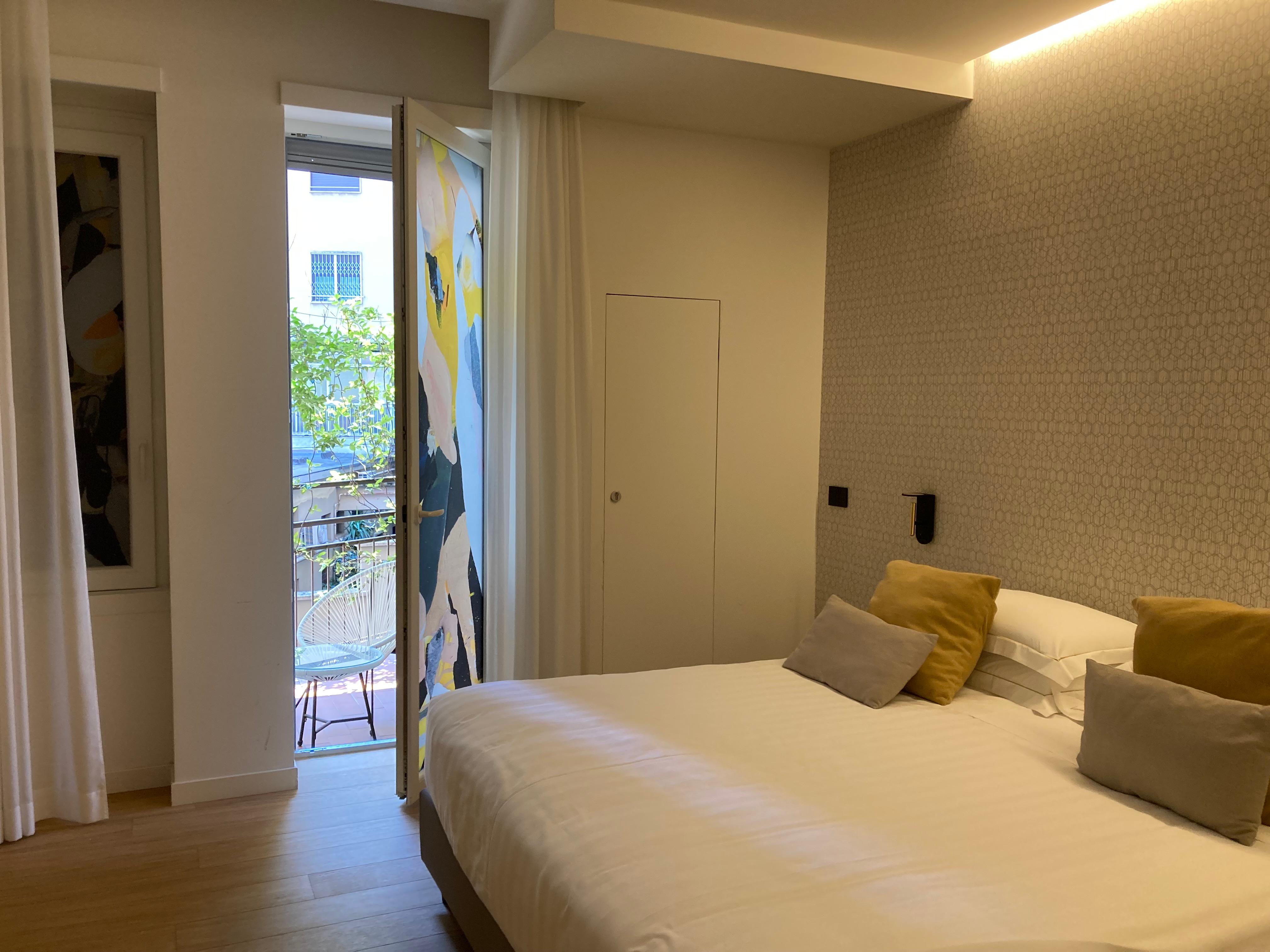 The main bedroom with a view of the balcony