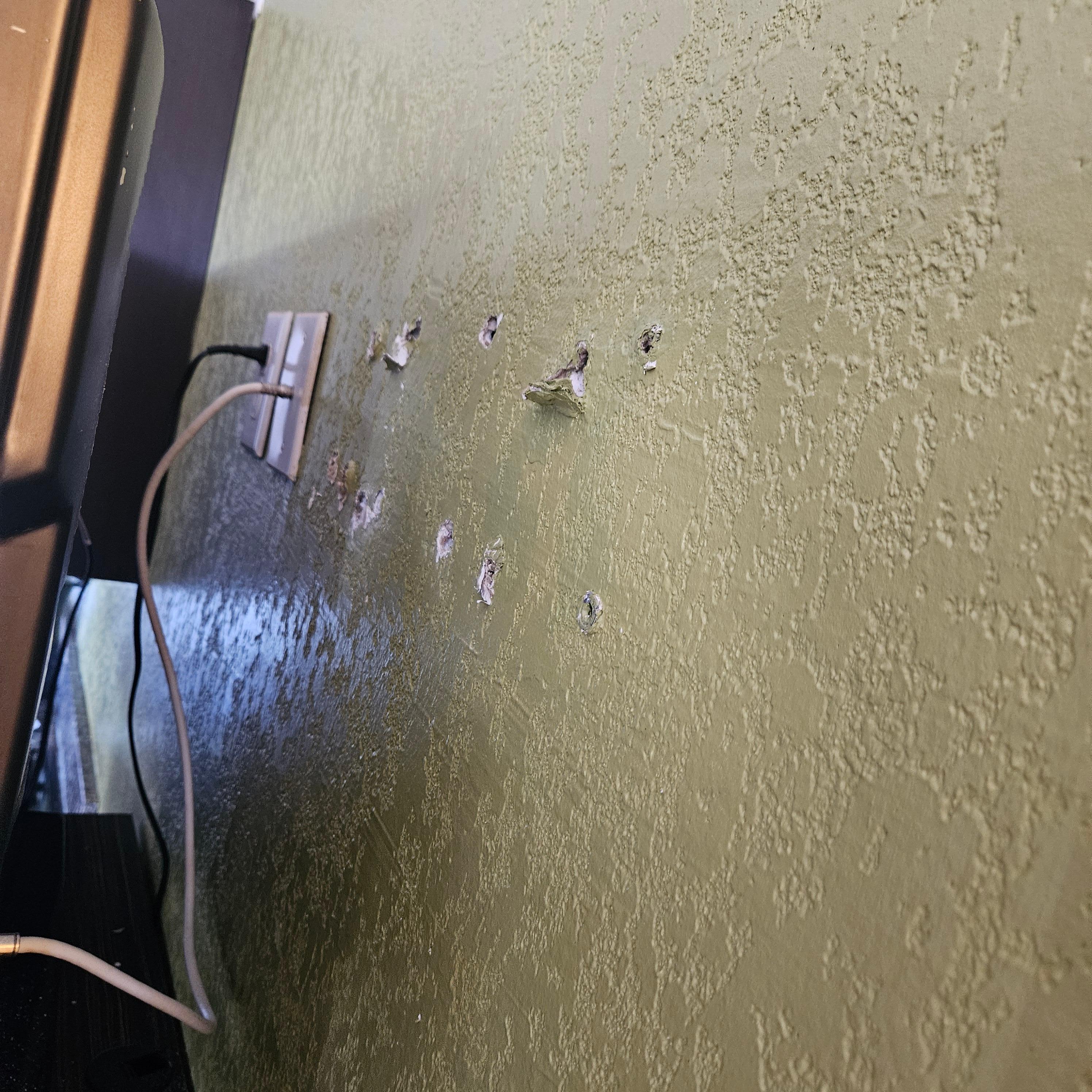 Holes in the wall.