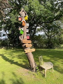 Creative direction sign in the garden, a place where one can truly enjoy and relax