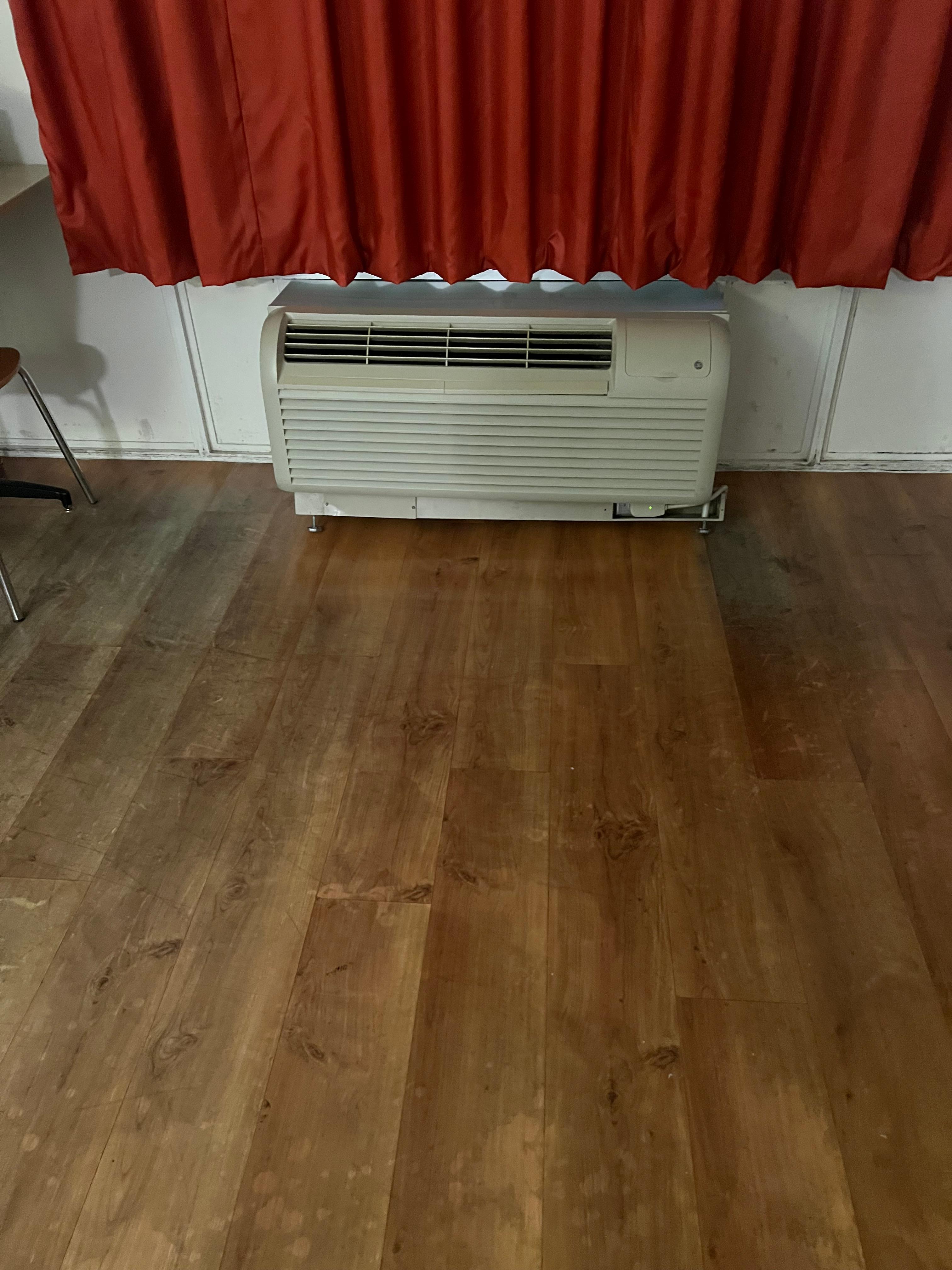 Floor is coated with grime, like they need to strip the floor.