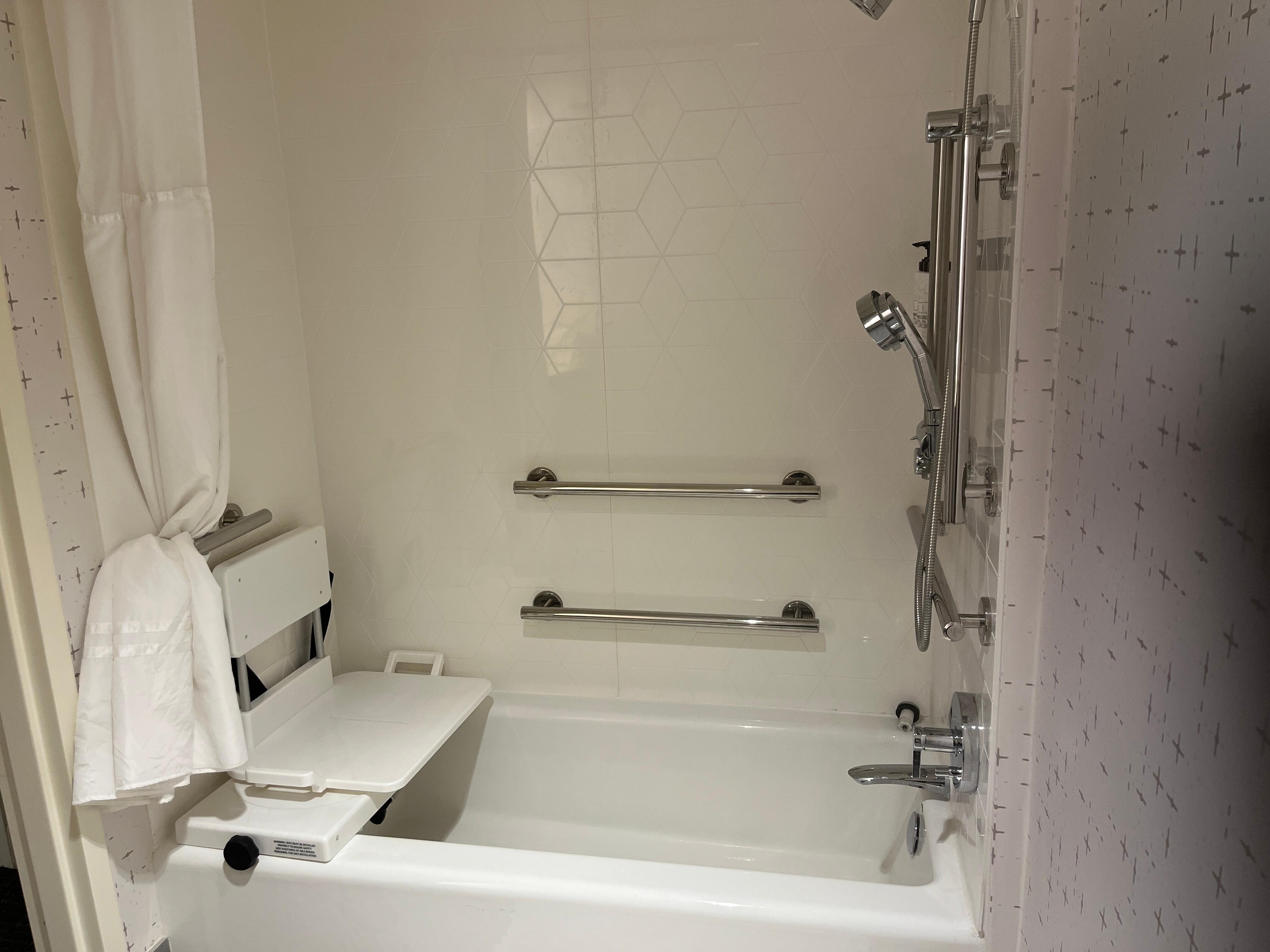 Appreciated the bathtub. Lifted out the plastic seat for more room.