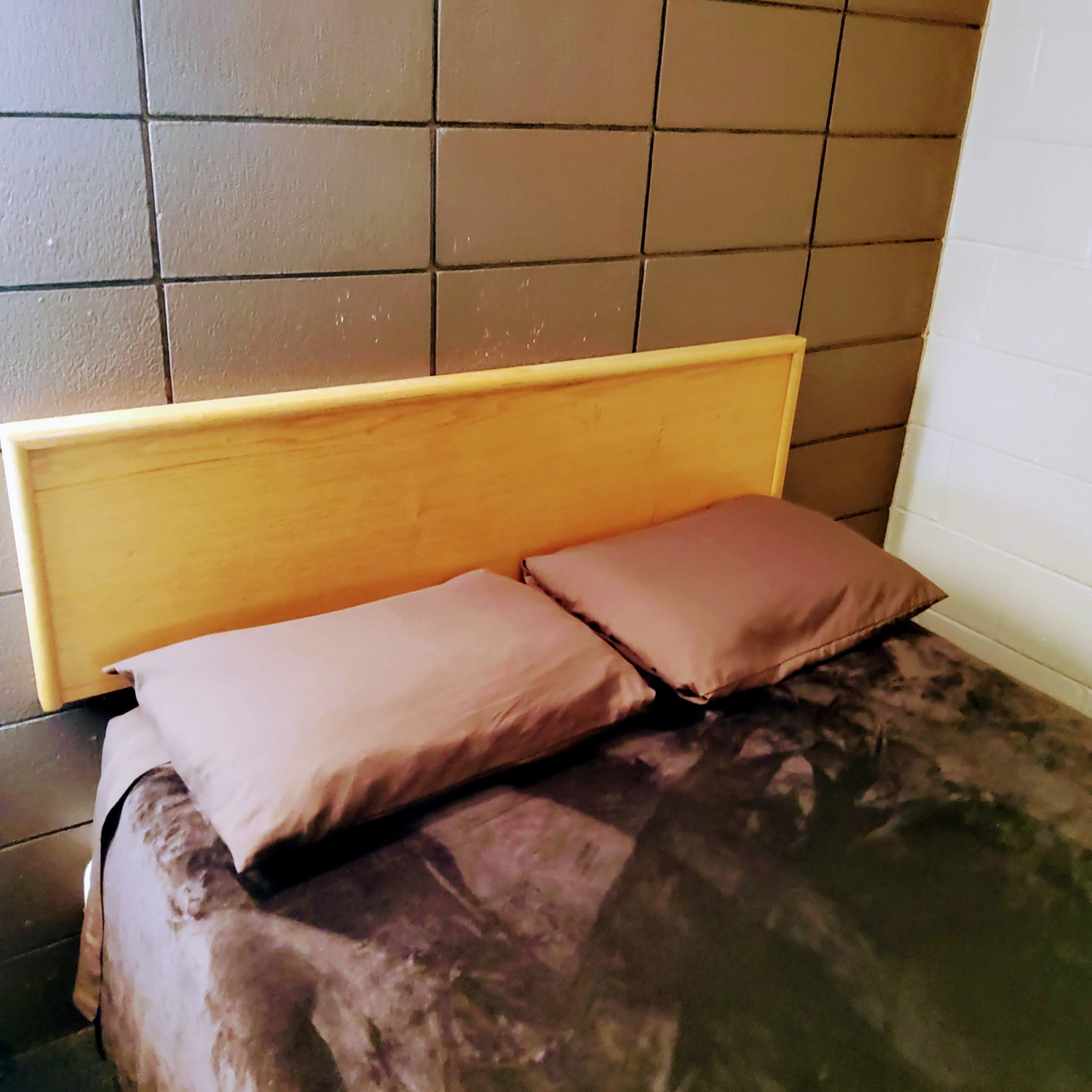 No white sheets here. Also the dark brown blanket did not have that inviting look.  