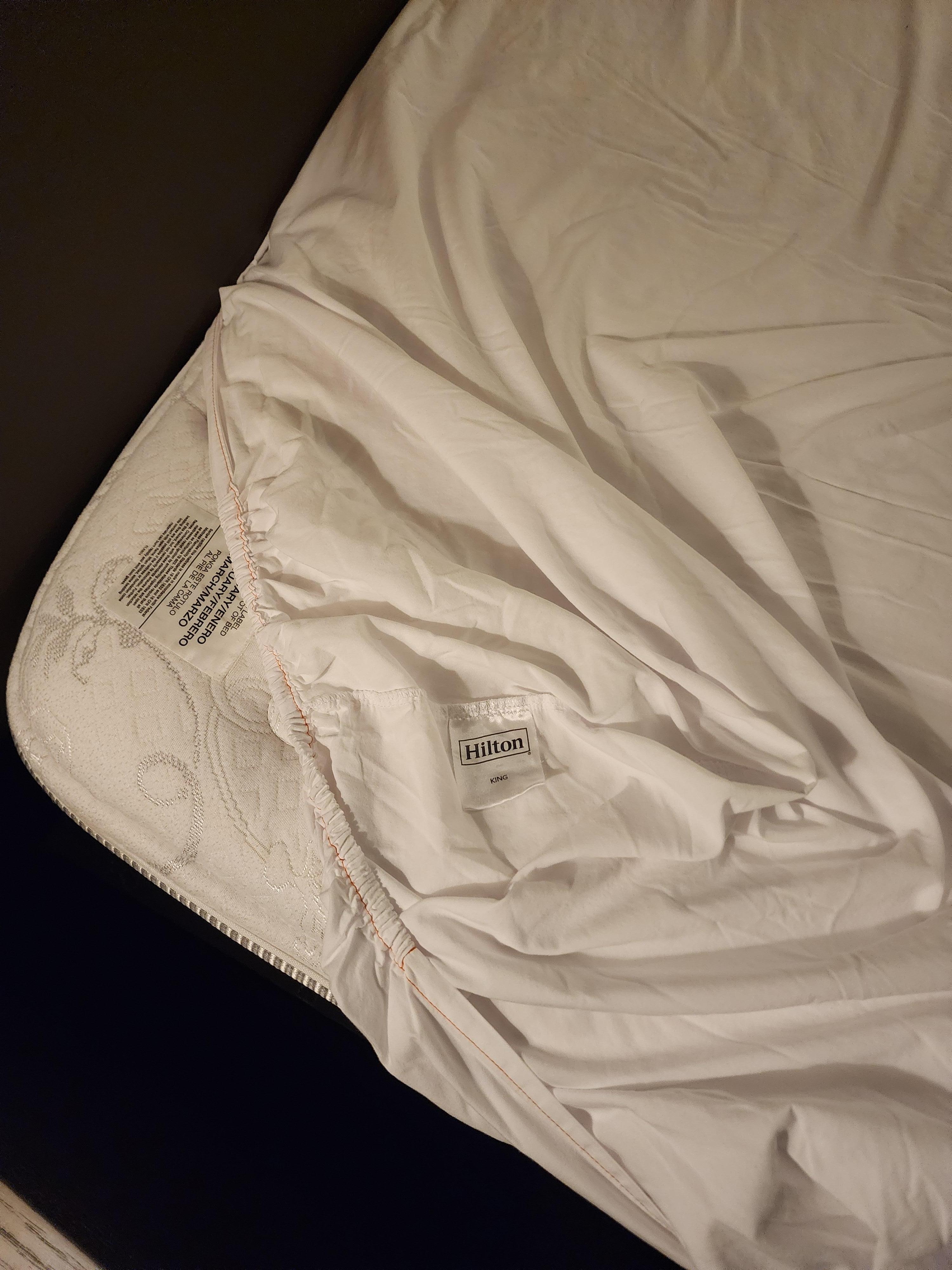 No mattress pad, just a fitted sheet on the nasty mattress. Not for $226.00 per night!No refund to paid room was given