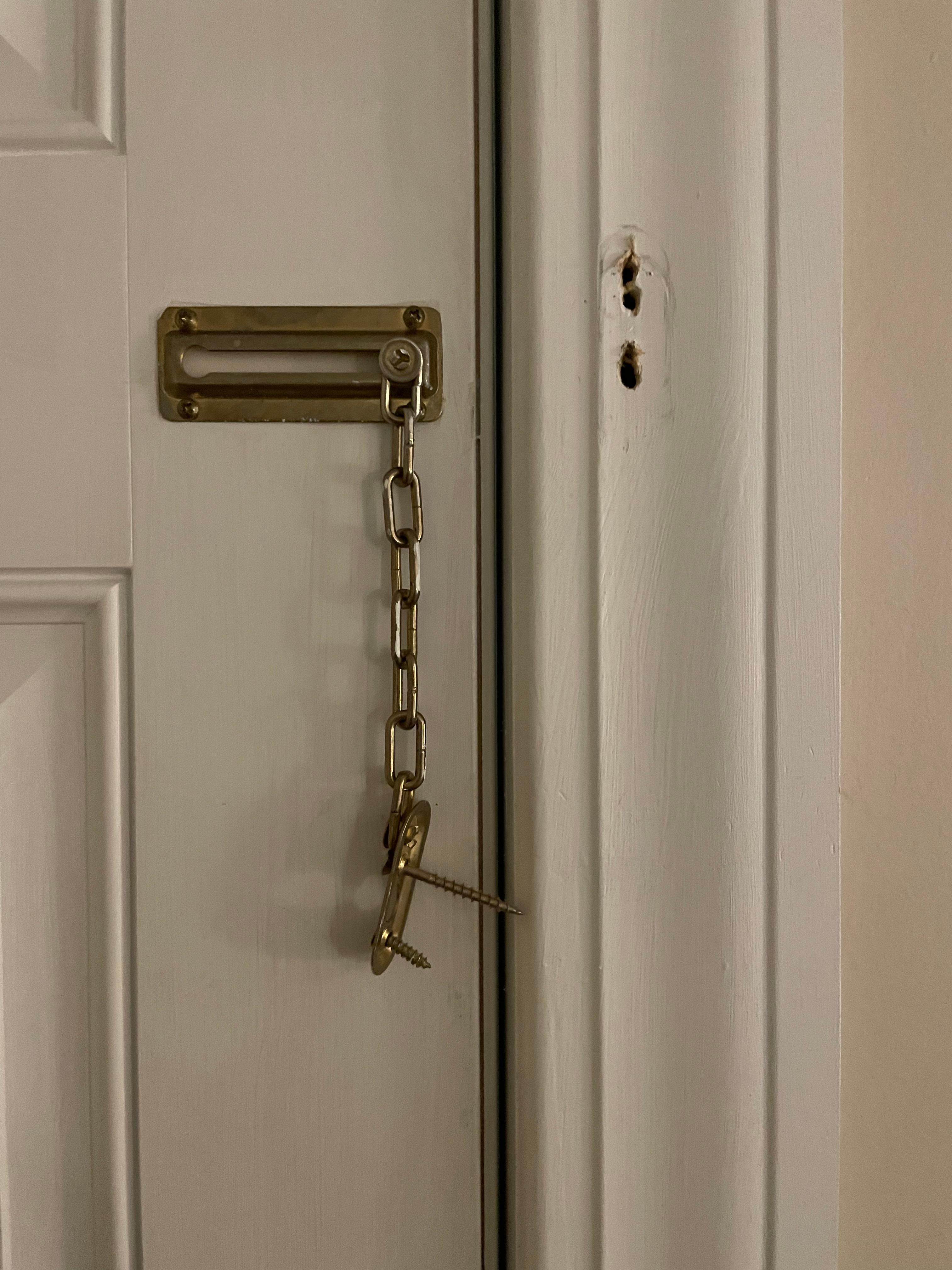 Chain lock unattached from door frame