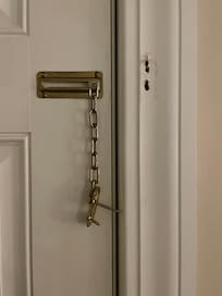 Chain lock unattached from door frame