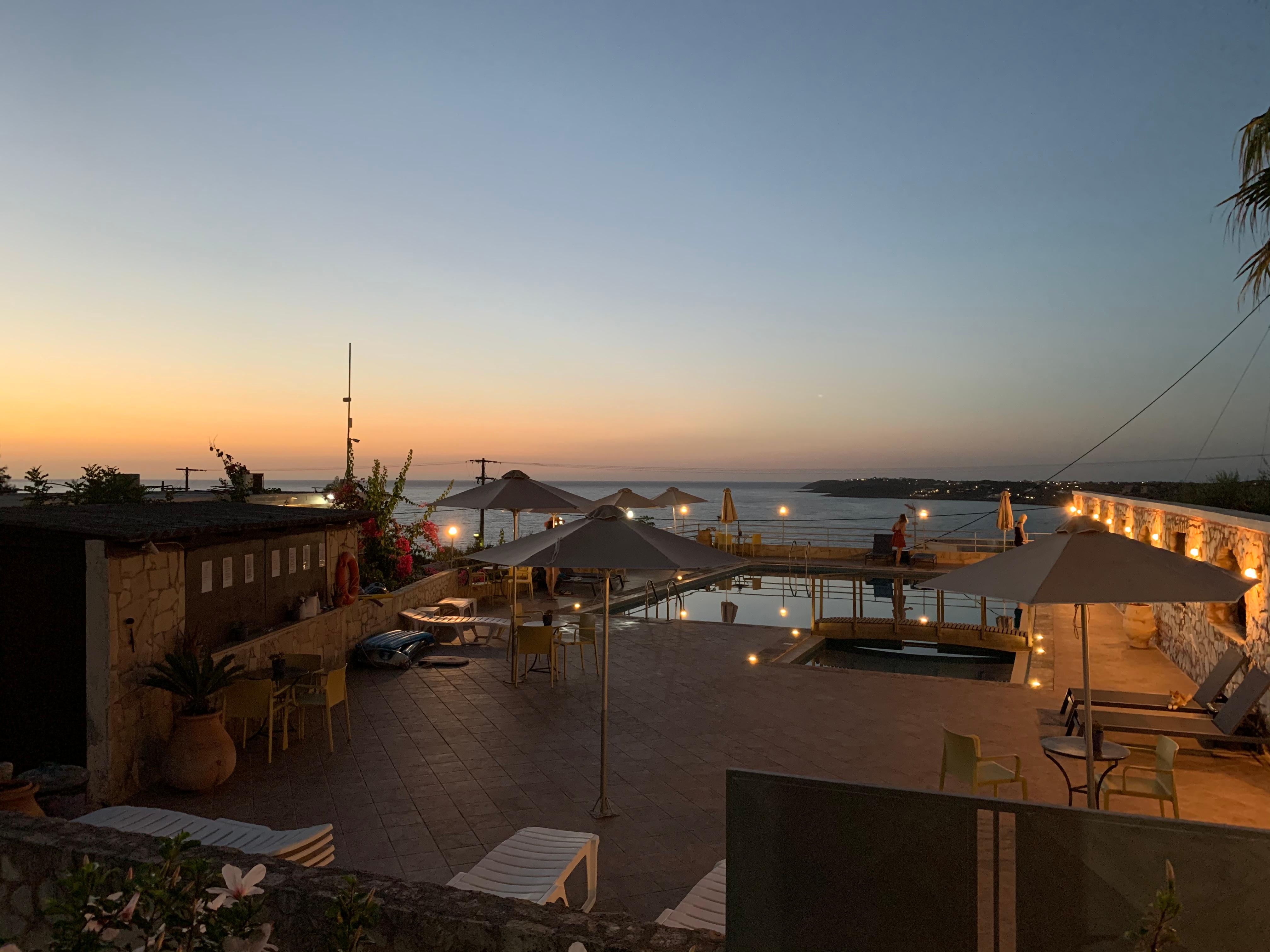 Sunset view of the hotel swimming pool.