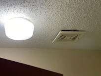 The bathroom fan barely worked and looked like it might fall out of the ceiling.