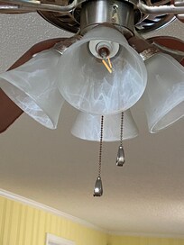 This is the living room fan with a broken bulb the the fixture
