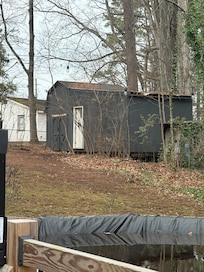 Abandoned shed chairs & debri inside