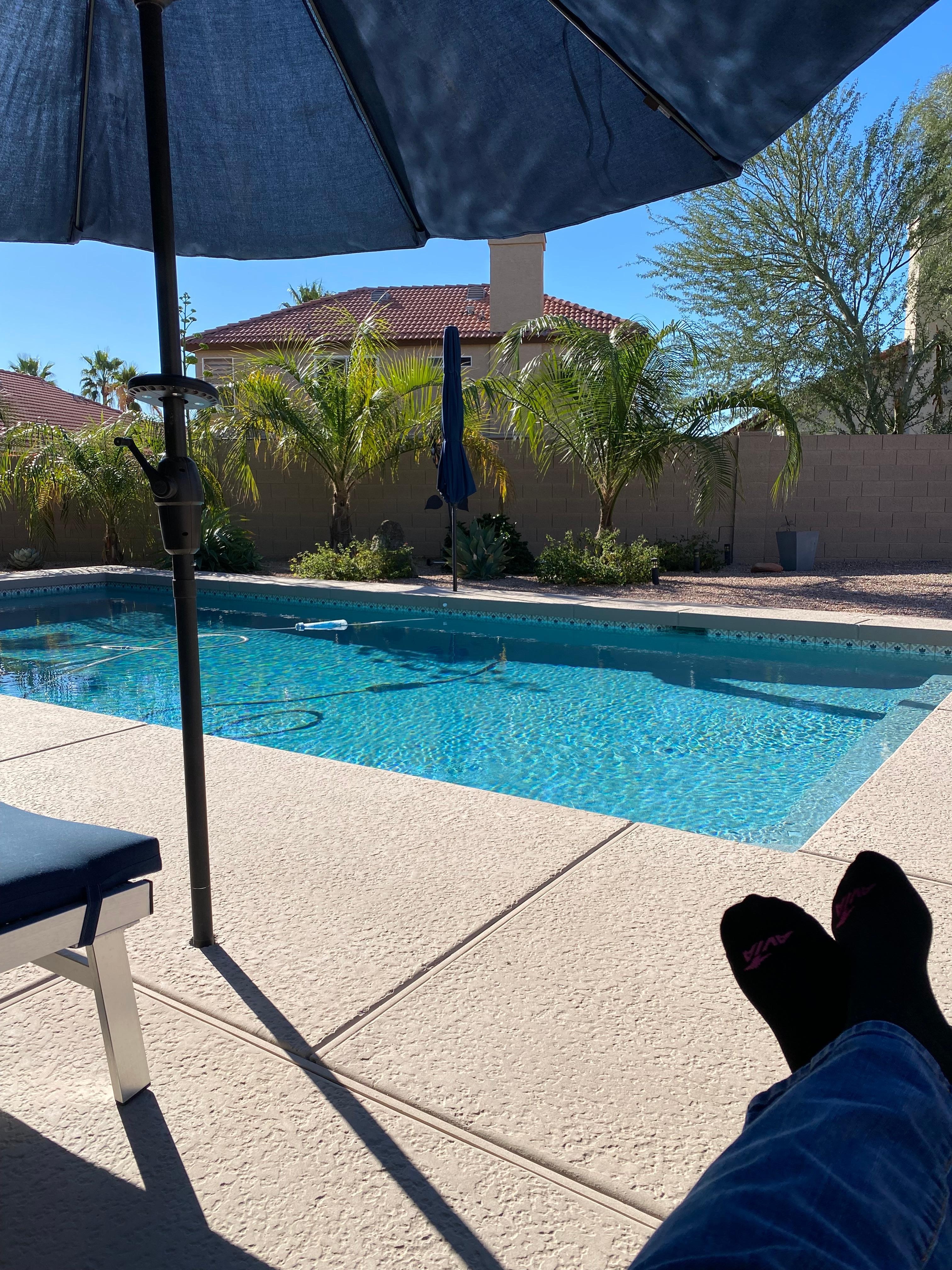 Relaxing by the private pool enjoying the shade from well placed umbrellas. 