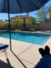 Relaxing by the private pool enjoying the shade from well placed umbrellas.