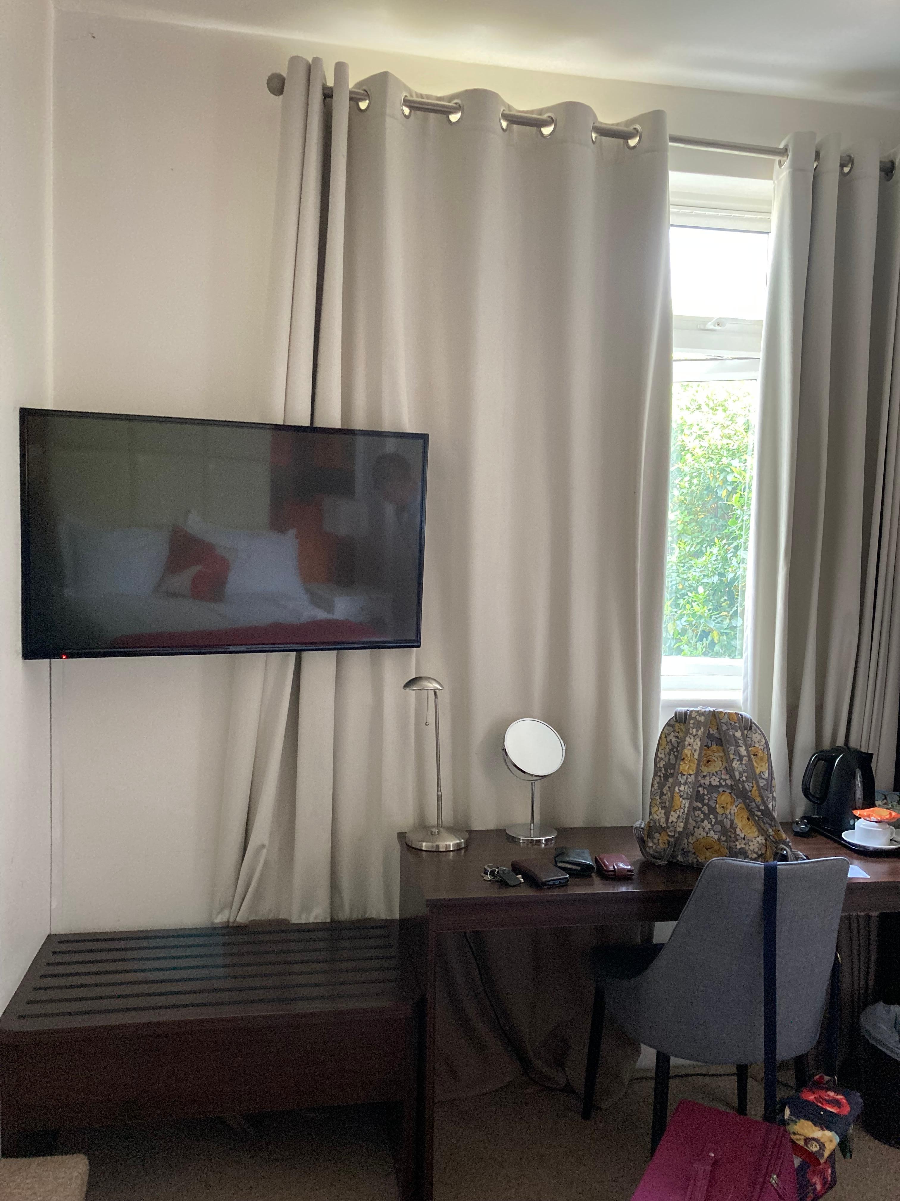 Large TV and dressing table.