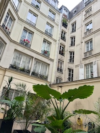 After secure street entrance, view of the courtyard.