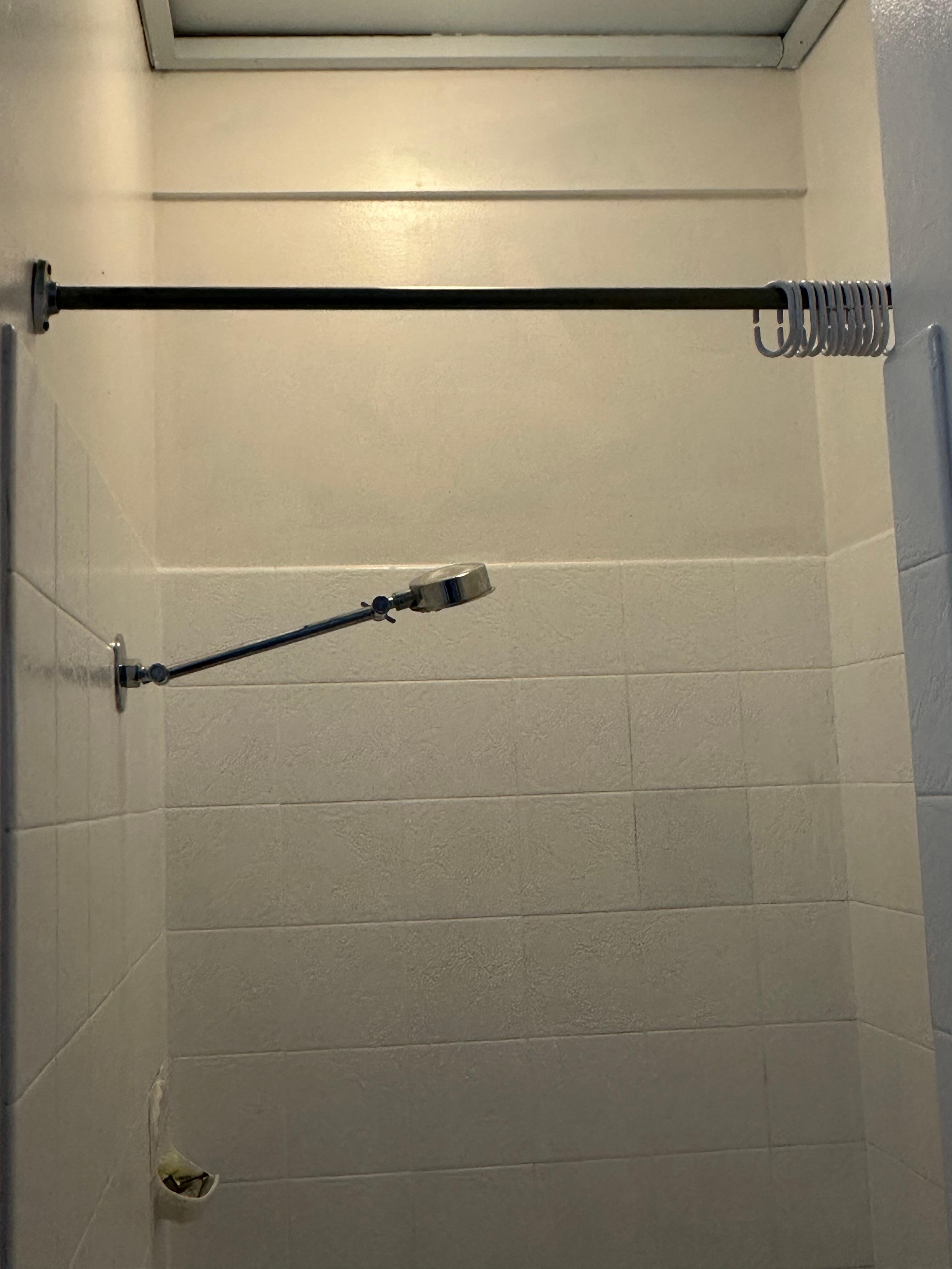 Shower curtain missing, floor gets wet and slippery 