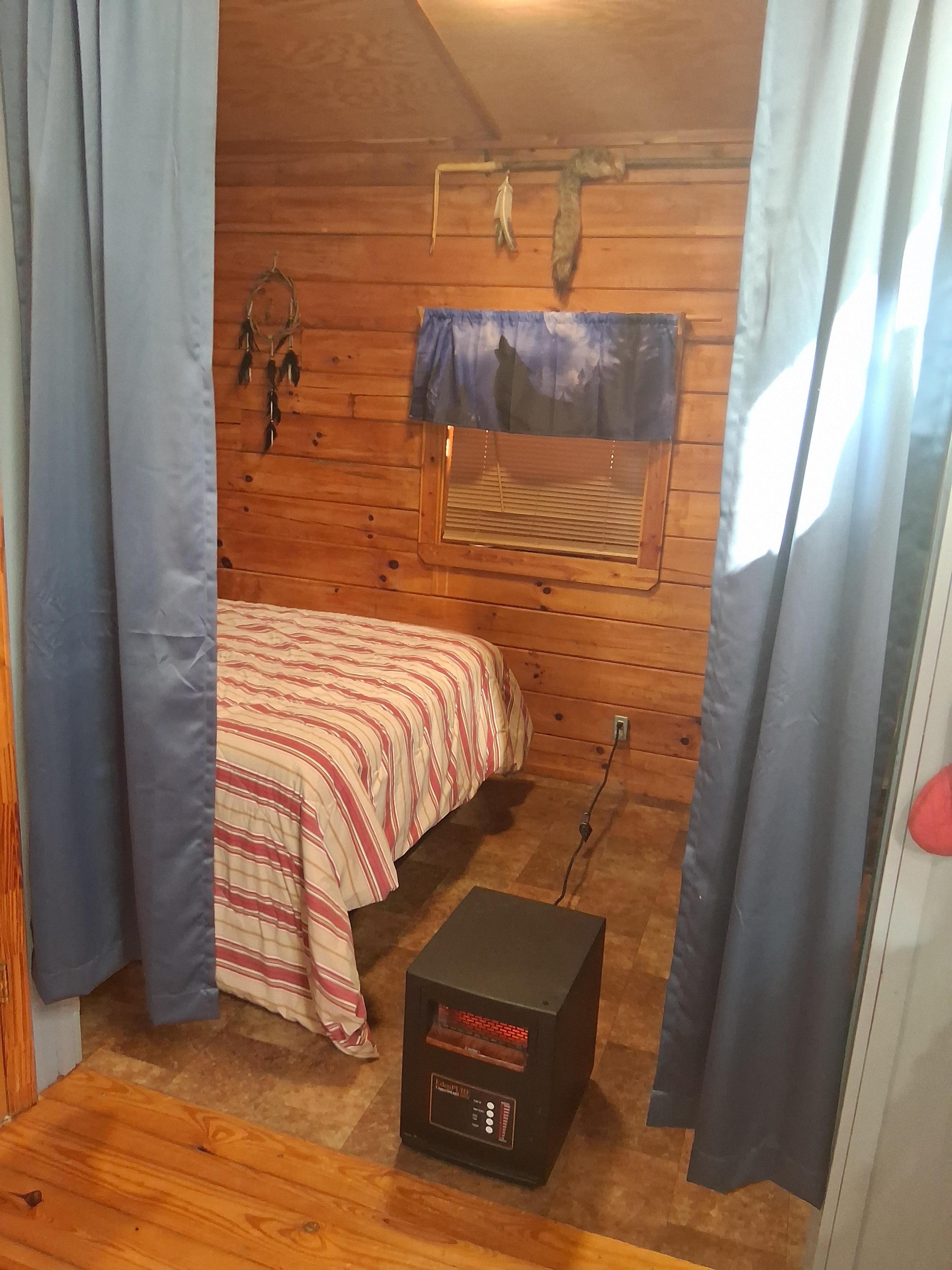 Bed "room" and heater. 