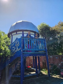 Sandpit and playhouse.