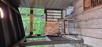 Relaxing rocker on porch. Plenty of hangers for fishing equipment.