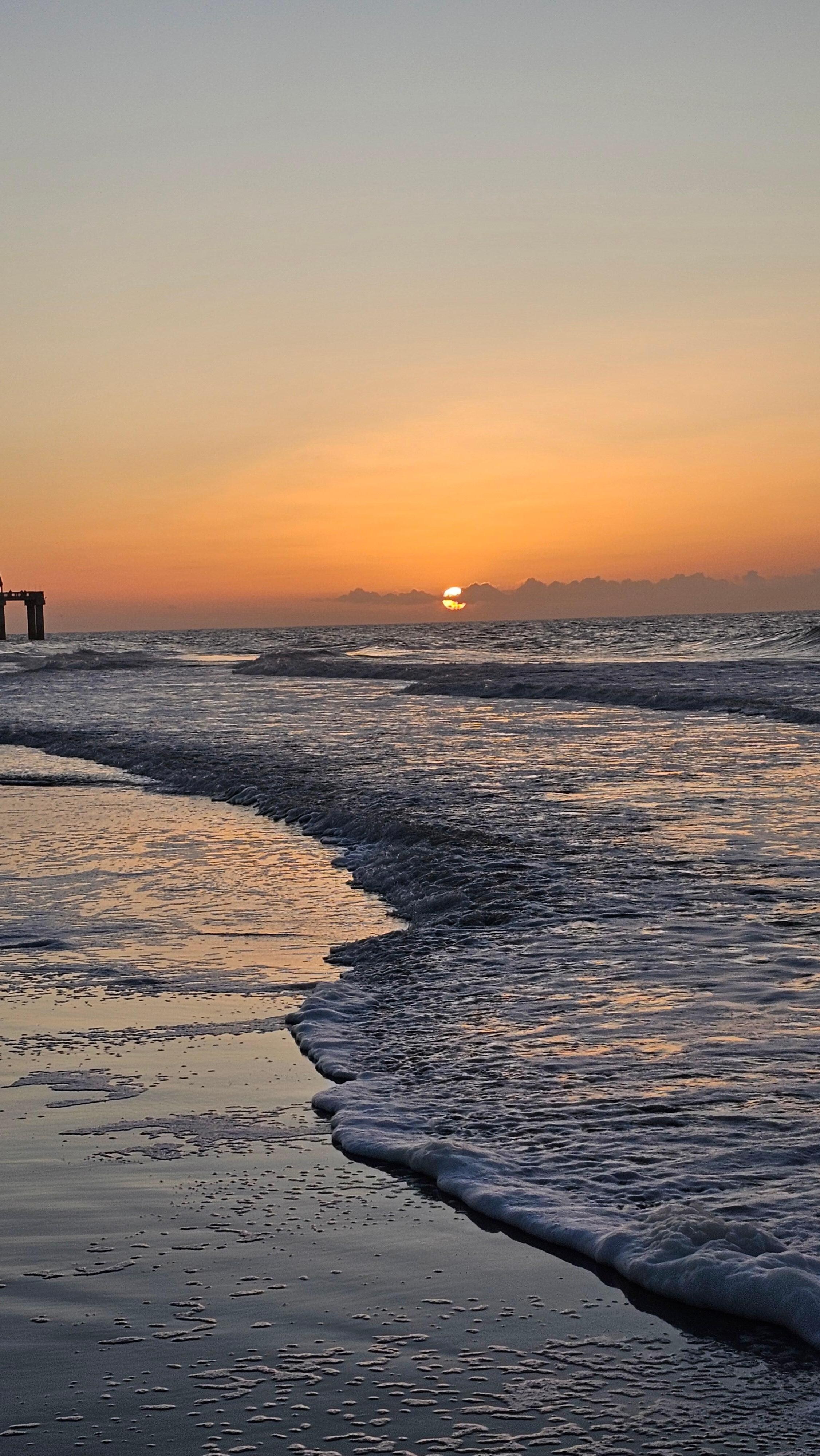 Sunrise down on the beach right down from the property.
