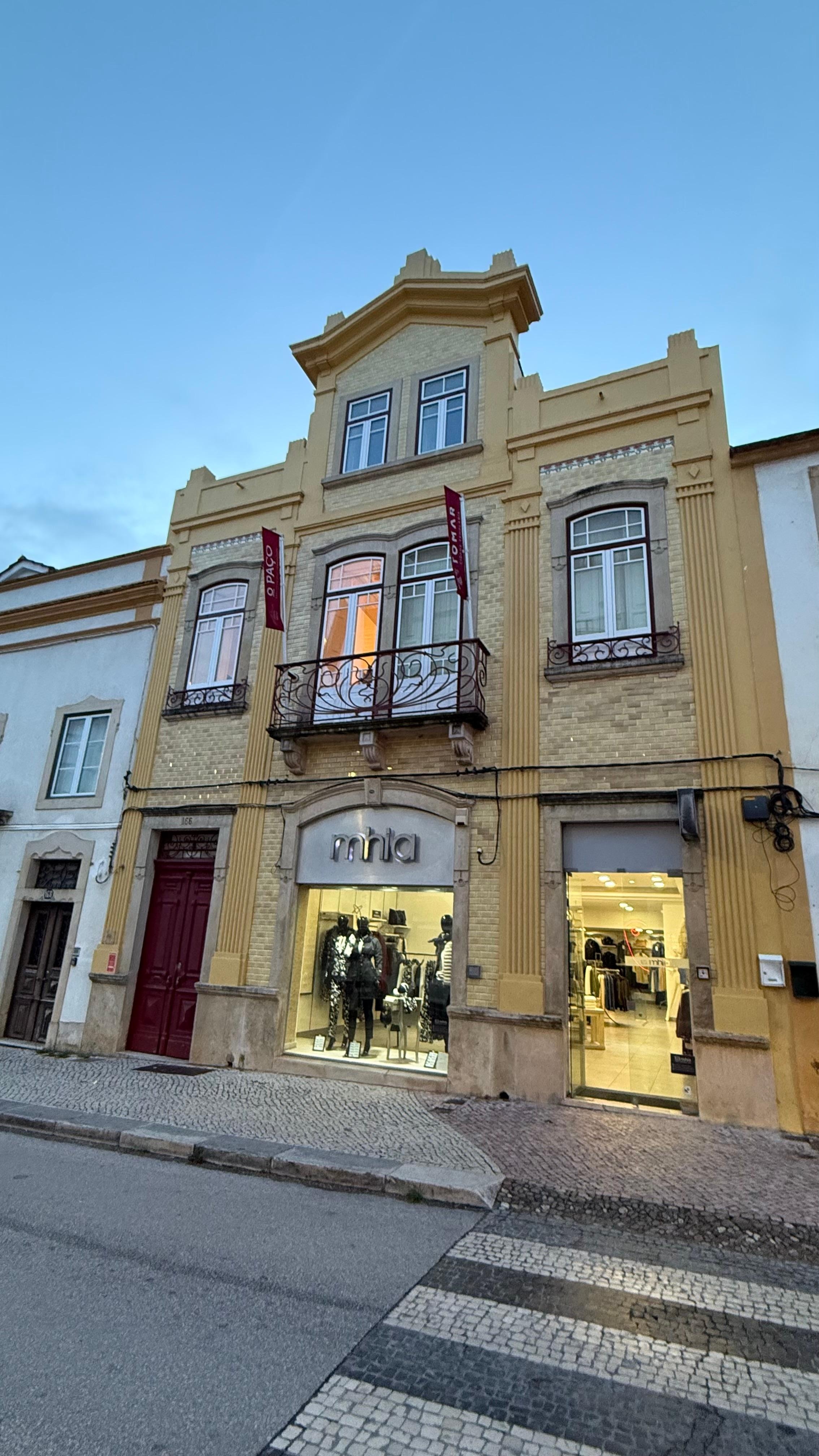 Outside the hotel. The entrance is this dark read door. (Please notice there is no 24h reception)