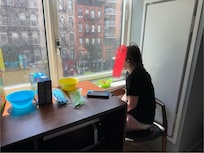 Child looking out the window from our room