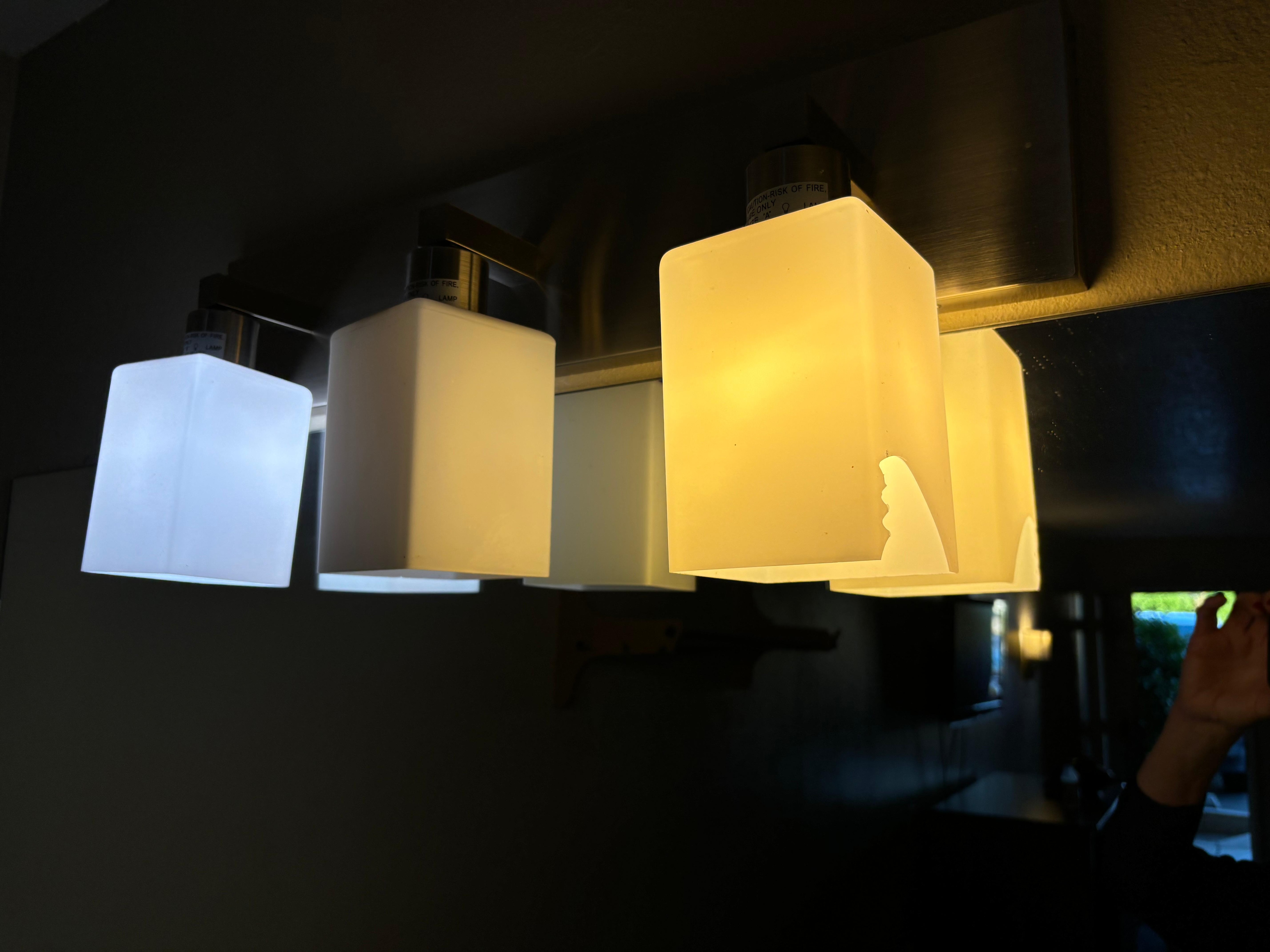 Broken light fixture; exposed sharp glass edges