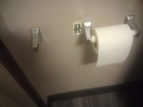 Broken/poorly affixed toilet paper dispensers