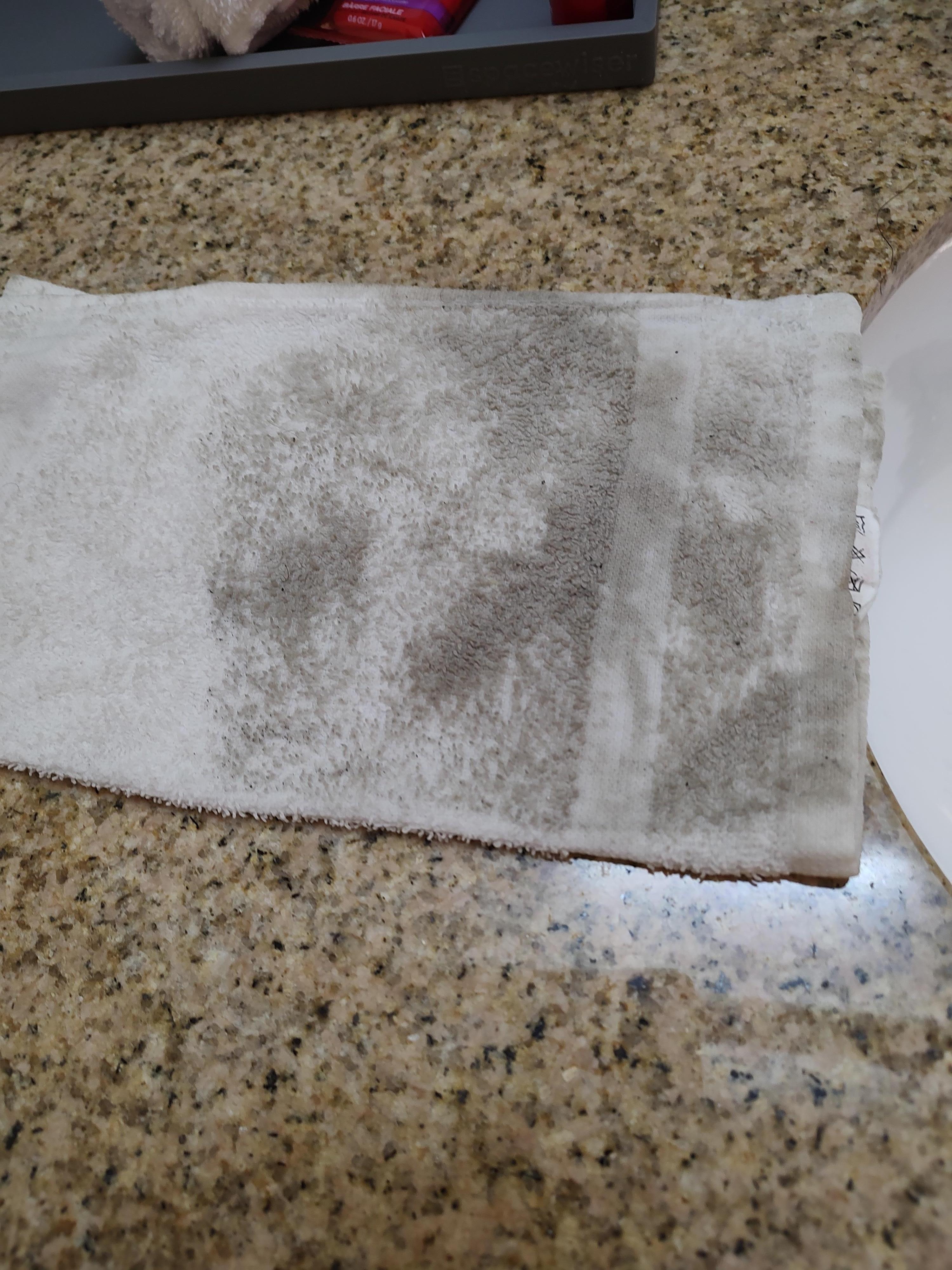 Wash cloth used to wipe desk top