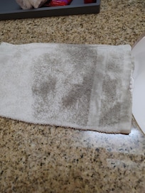Wash cloth used to wipe desk top