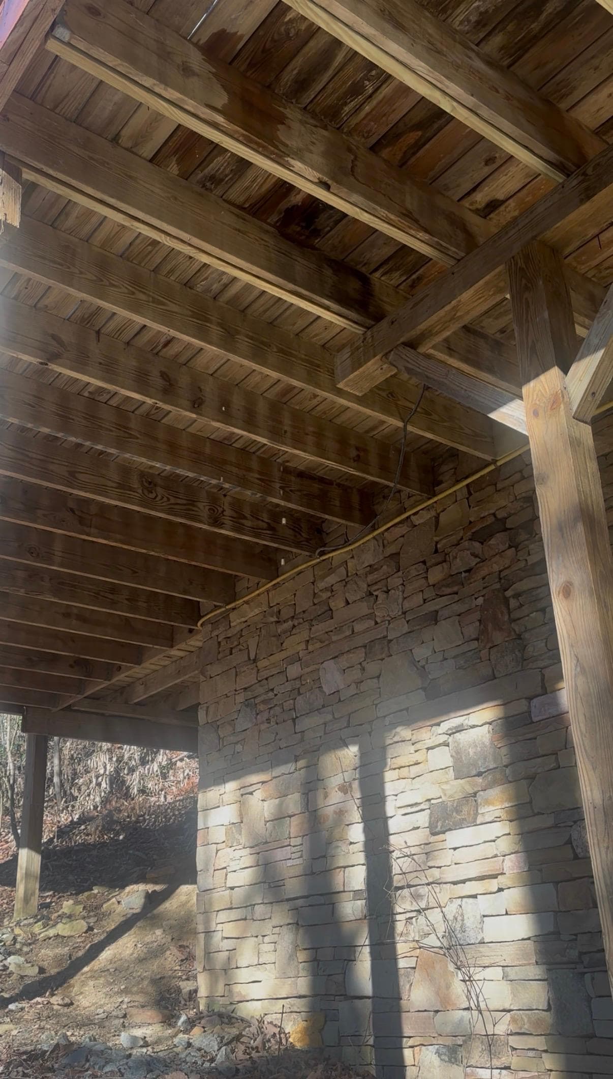 Beneath the hot tub.