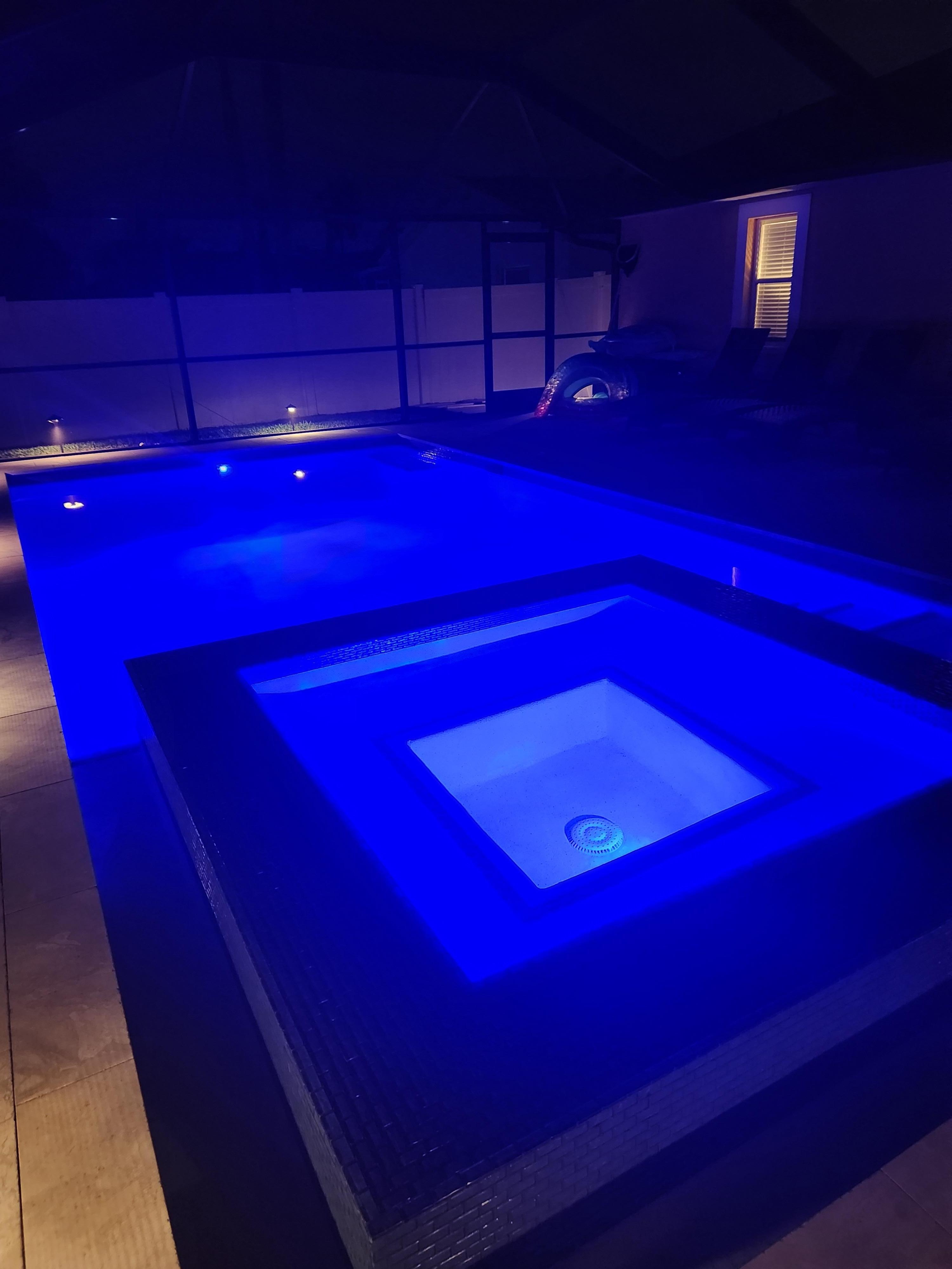 Pool & hot tub at night.