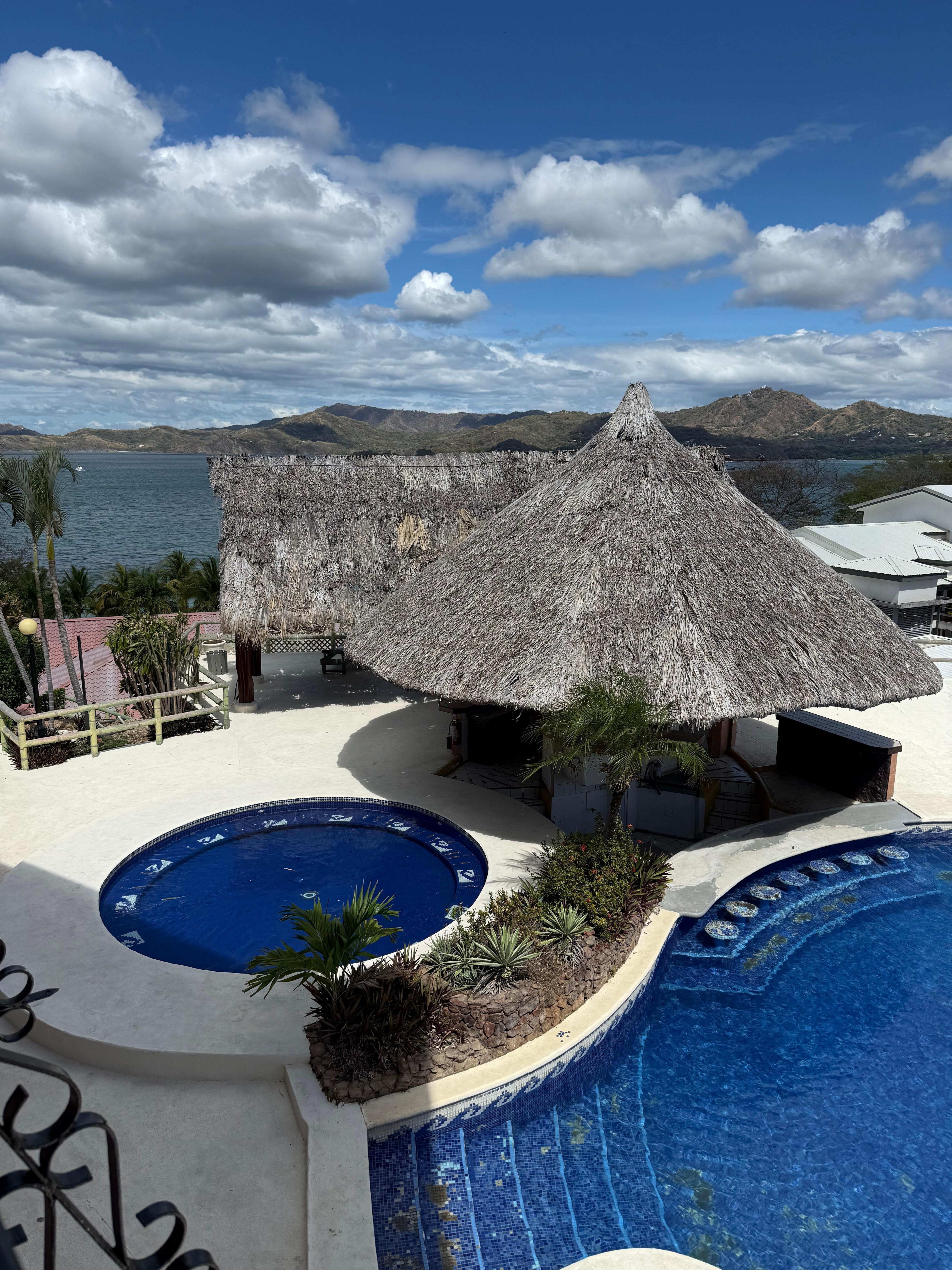 Outside at the pool its missing tiles, the roof looks like it could have fallen down any time. Dead birds around the once outside bar. 
