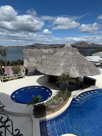 Outside at the pool its missing tiles, the roof looks like it could have fallen down any time. Dead birds around the once outside bar.