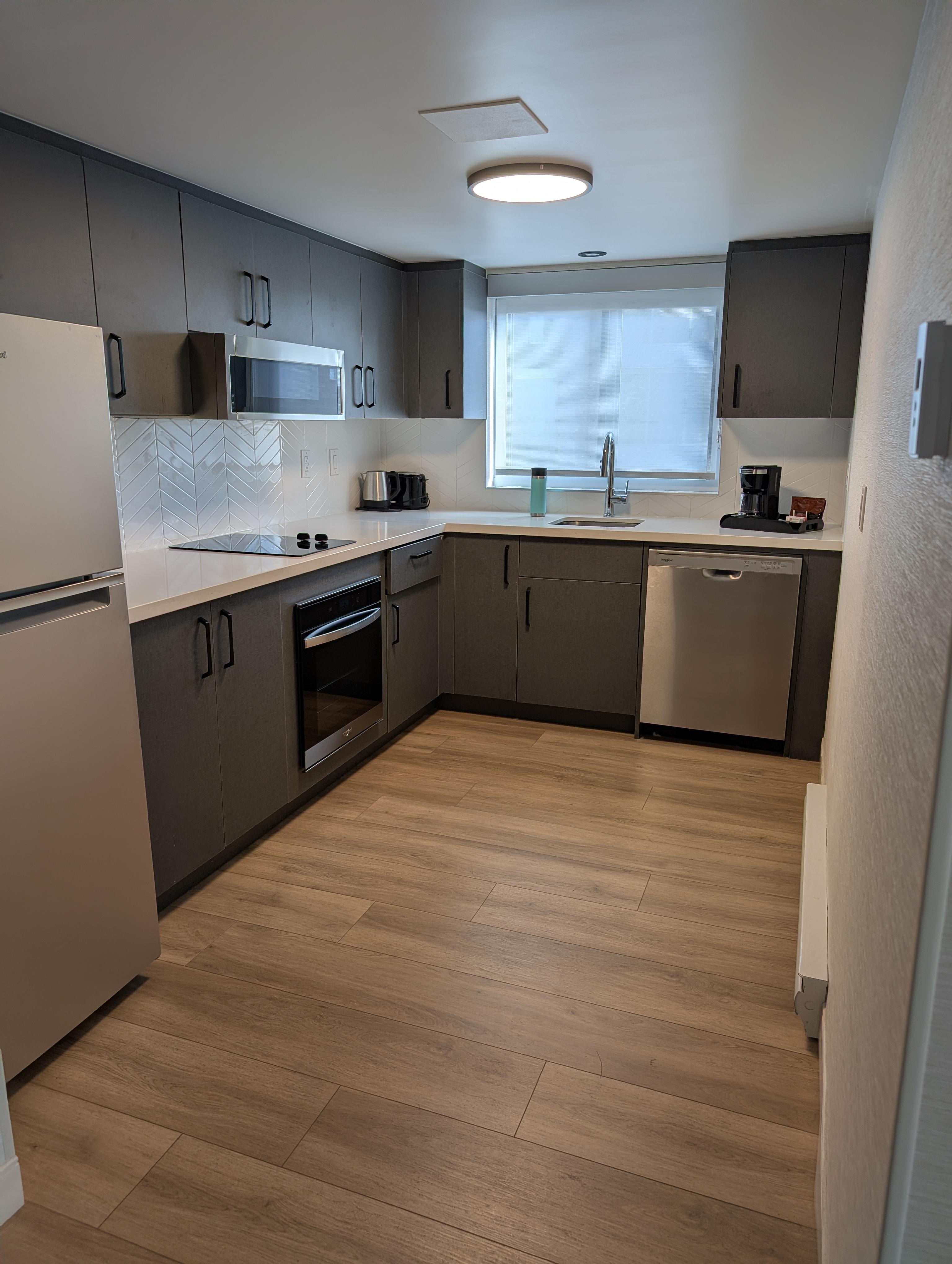 Kitchen with oven, and dishwasher