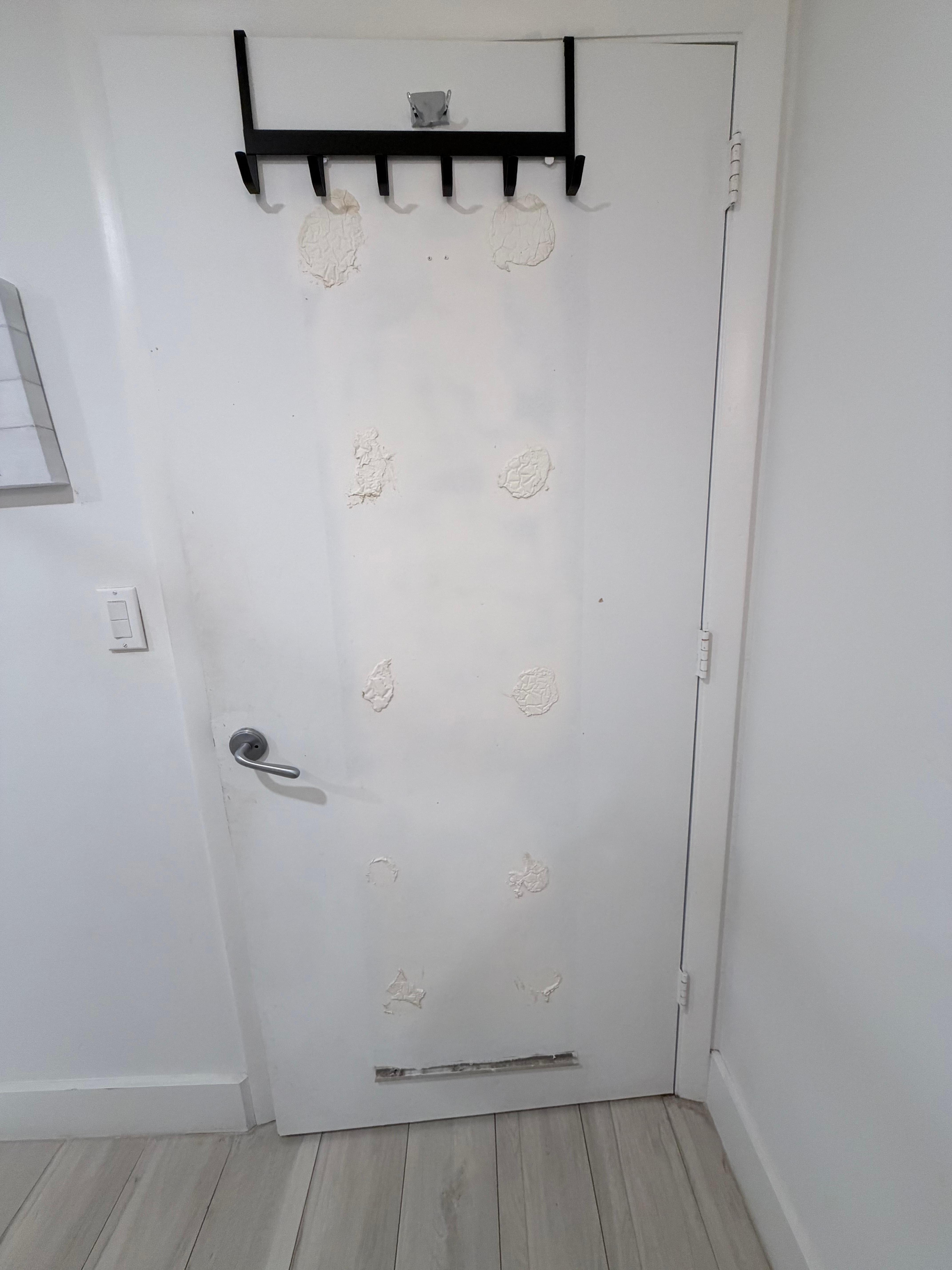 Bathroom door with major damage